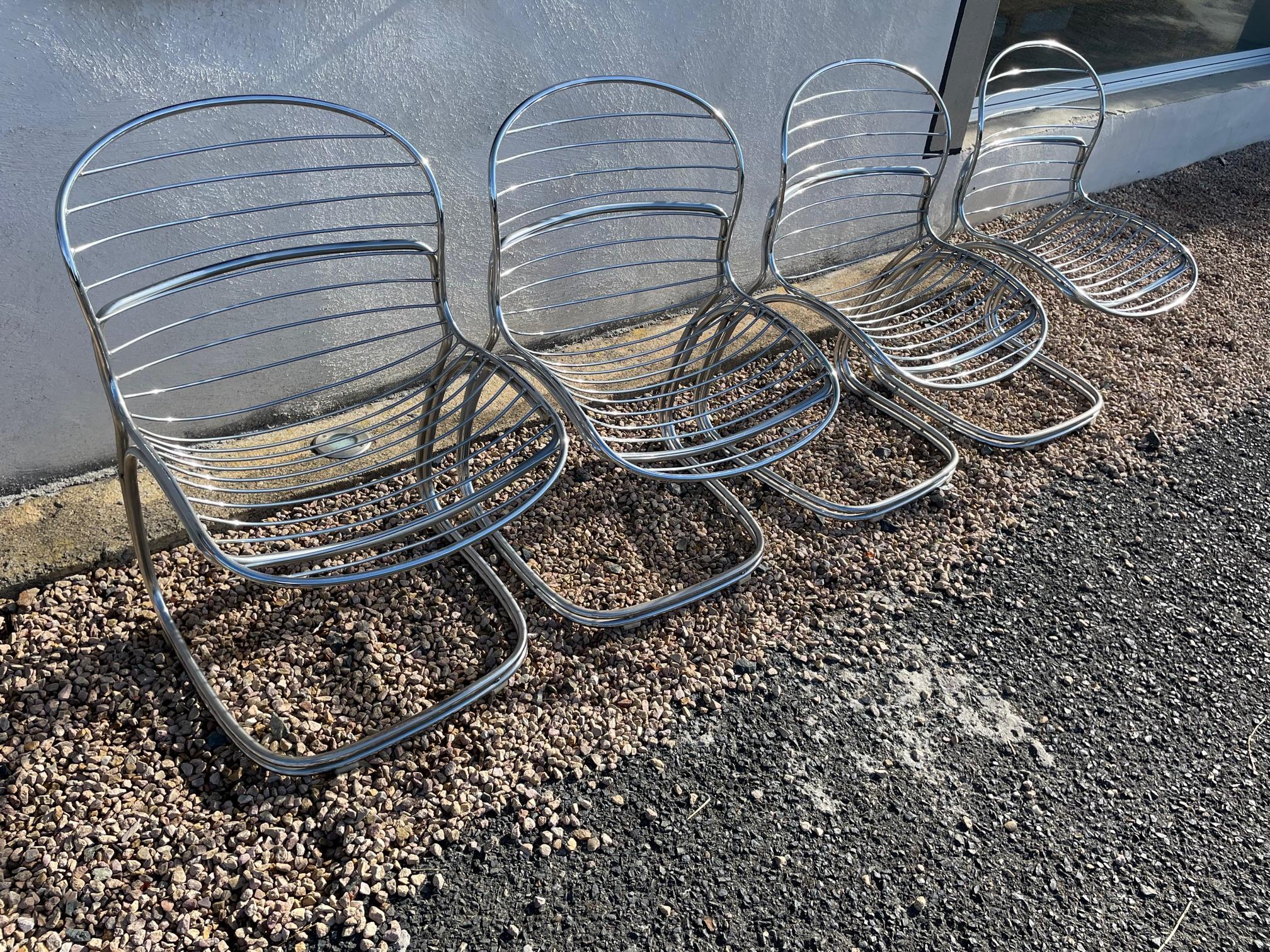 Very nice 20th century set of four chairs made by the Italian Designer Gastone Rinaldi in the 1970s. 
Metal chromed chairs. Very comfortable. 
Nice quality.