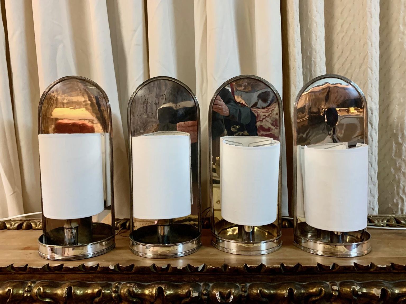 Set of four sconces in silver metal and wax imitating a candle, from the Spanish house Valenti.
The lampshades are current in off-white, electrical installation update and renewed electrical installation.
     