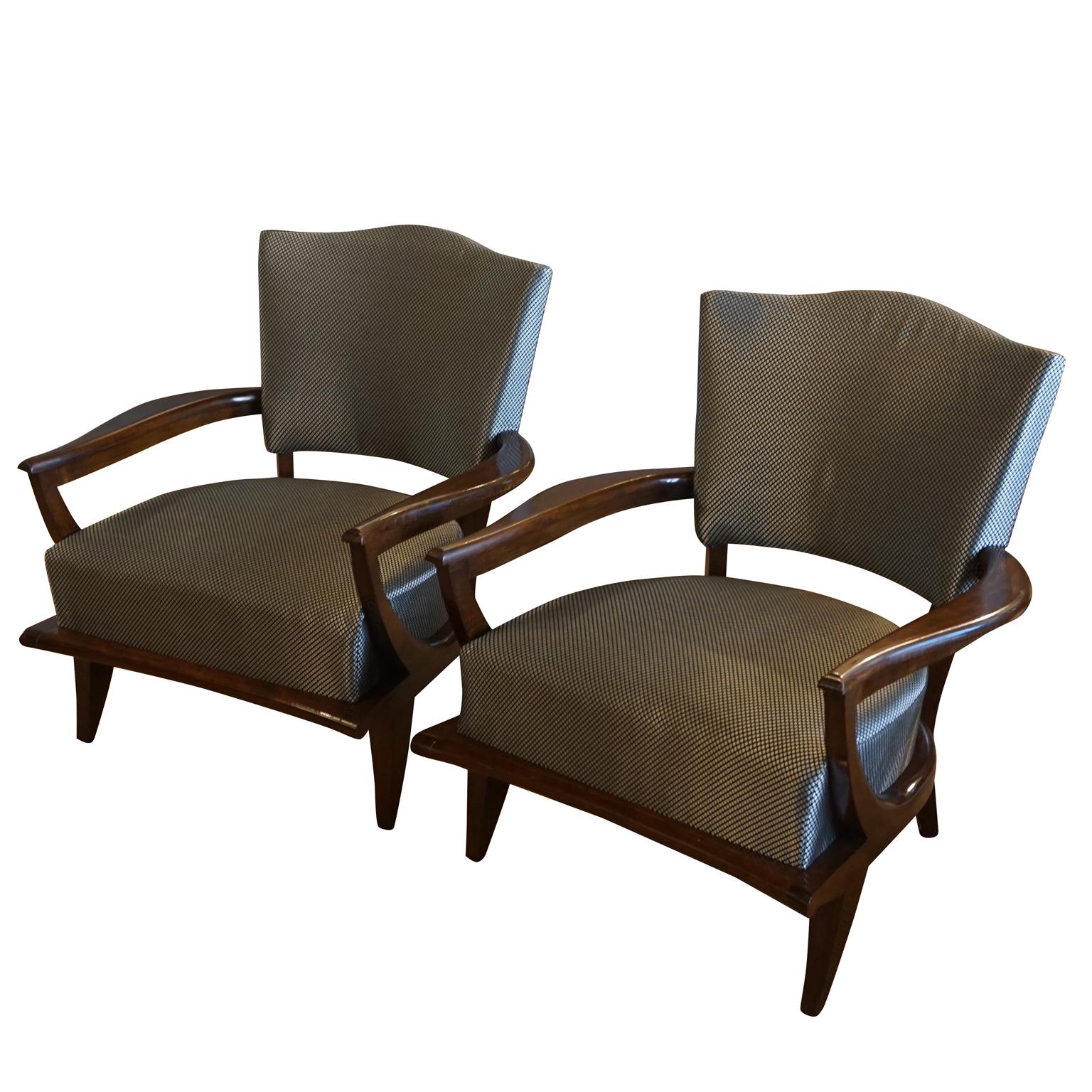 A vintage Art Deco pair of French lacquered armchairs made of hand carved oakwood and newly upholstered in a Pierre Frey fabric. Designed by Etienne-Henri Martin and produced by Steiner, in good condition. Wear consistent with age and use, circa