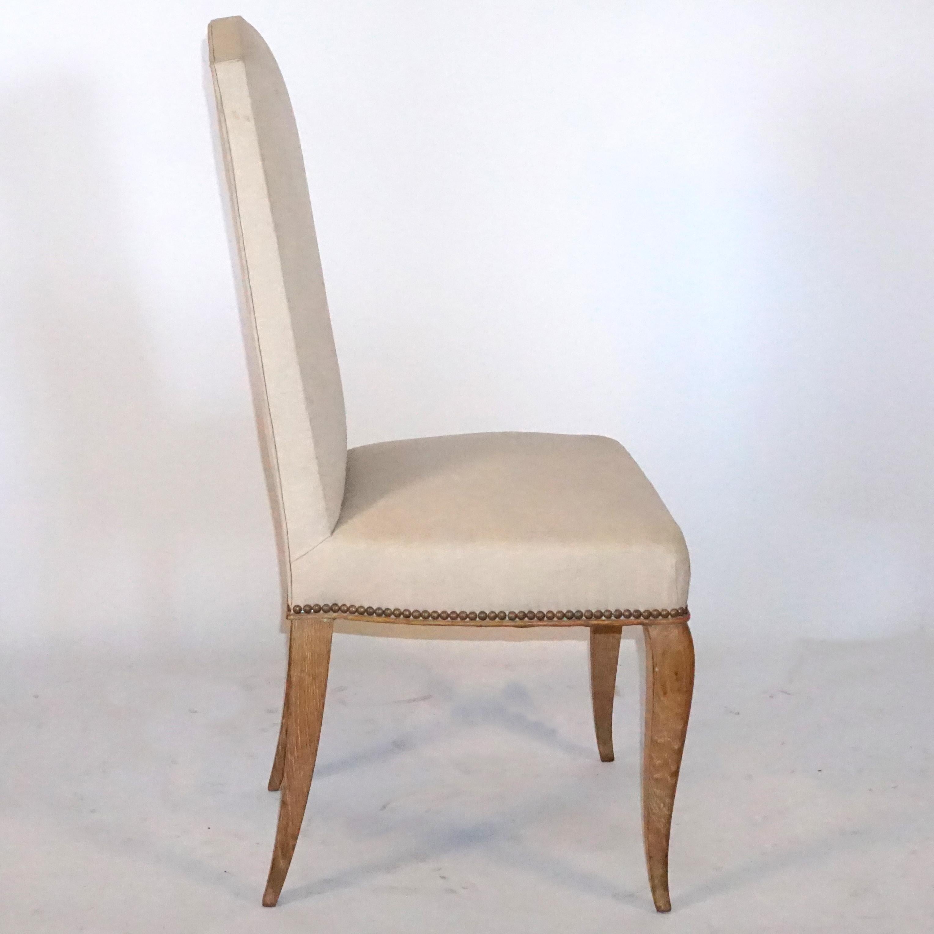 A set of six French reused oak dining chairs, with high backrest recovered in velvet fabric.

Measures: Seat 18.5” H