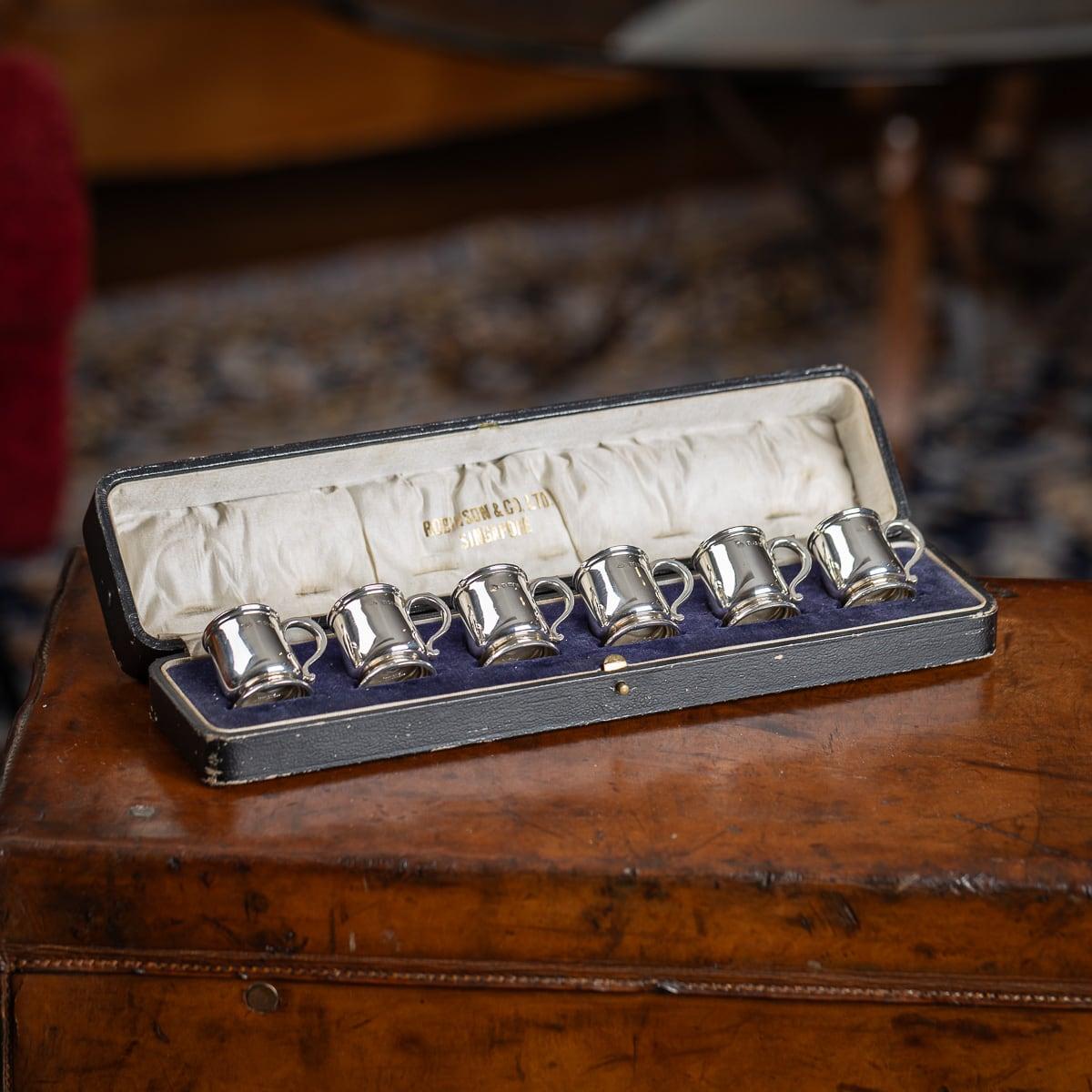 Early 20th Century set of six solid silver novelty miniature tankards, used as shots, The set of six tankards come in the original retail box. Hallmarked English silver (925 standard), Birmingham, year 1926 (B), Makers mark ABros (Adie Brothers