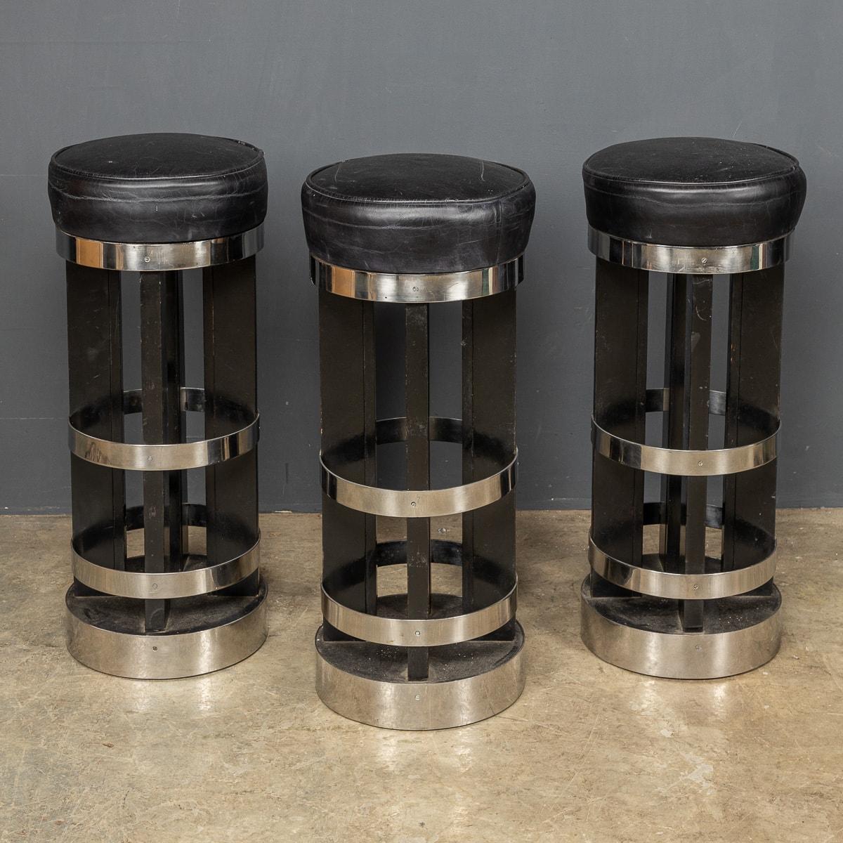 A mid 20th Century set of three leather and chrome swivel top bar stools straight from an iconic American diner.

CONDITION
In Great Condition - The leather has some wear consistent with age

SIZE
Height: 80cm
Diameter: 35cm.