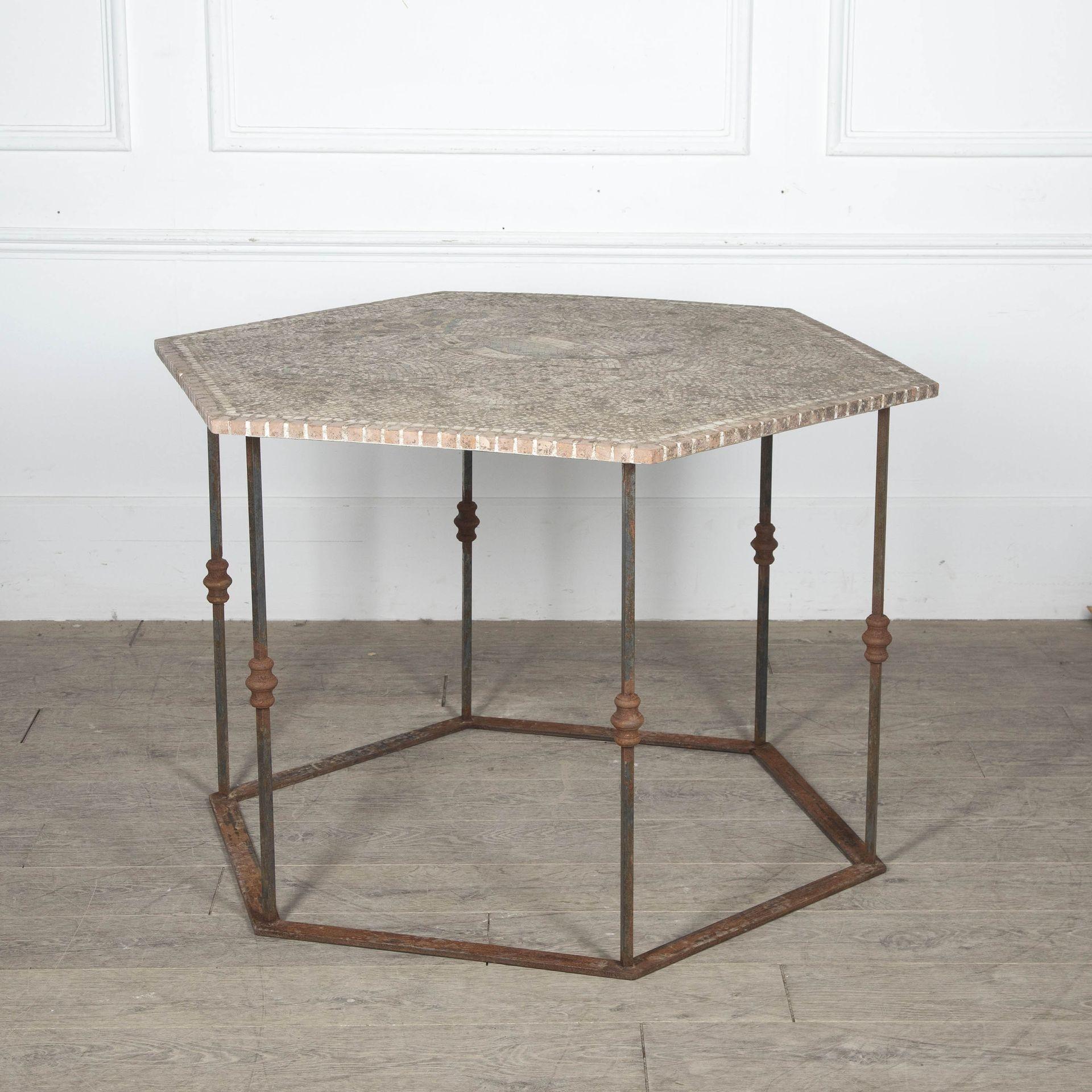 20th Century weathered Sicilian mosaic garden table top on a later iron base.
Displaying a gecko the symbol of Sicily.