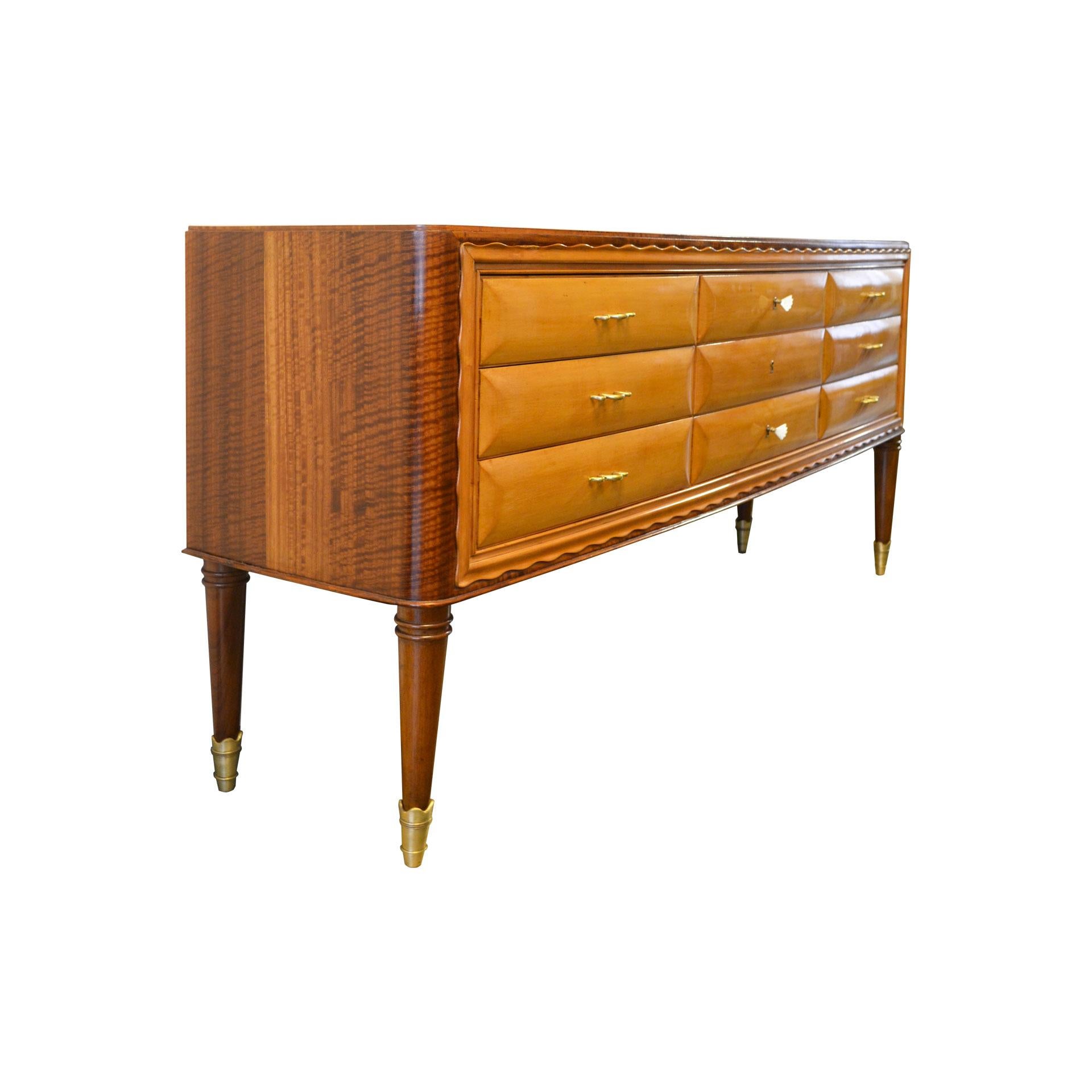 Sideboard with drawers in the style of Paolo Buffa designed in 1950s with structure in wood and very particular handles in brass. Very good condition. Original in all its parts.