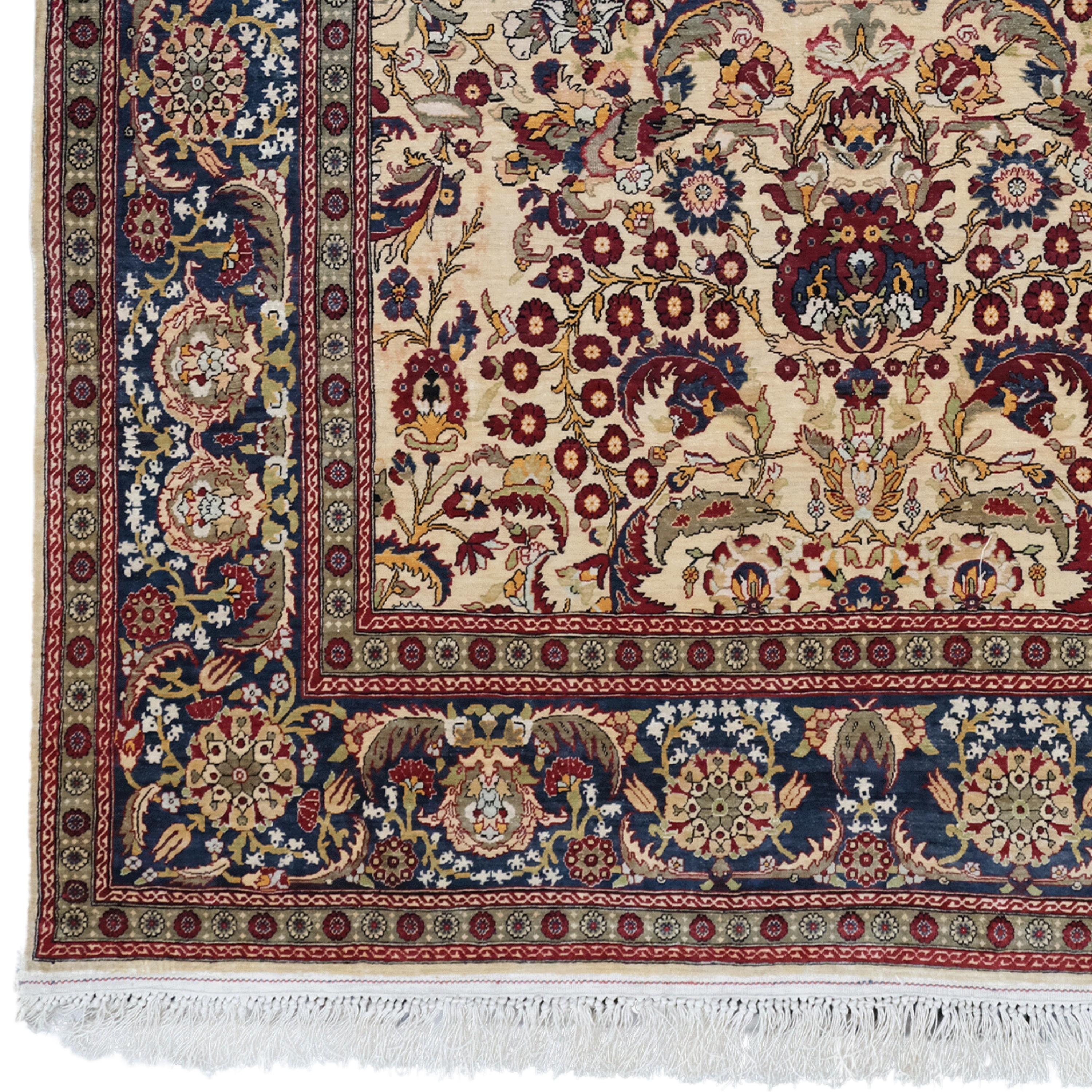 This 20th century antique Turkish Anatolian silk Hereke rug is both rich in history and an exquisite work of art. Fine workmanship is evident in every detail of this hand-woven carpet. Intertwined geometric patterns and motifs are blended with a