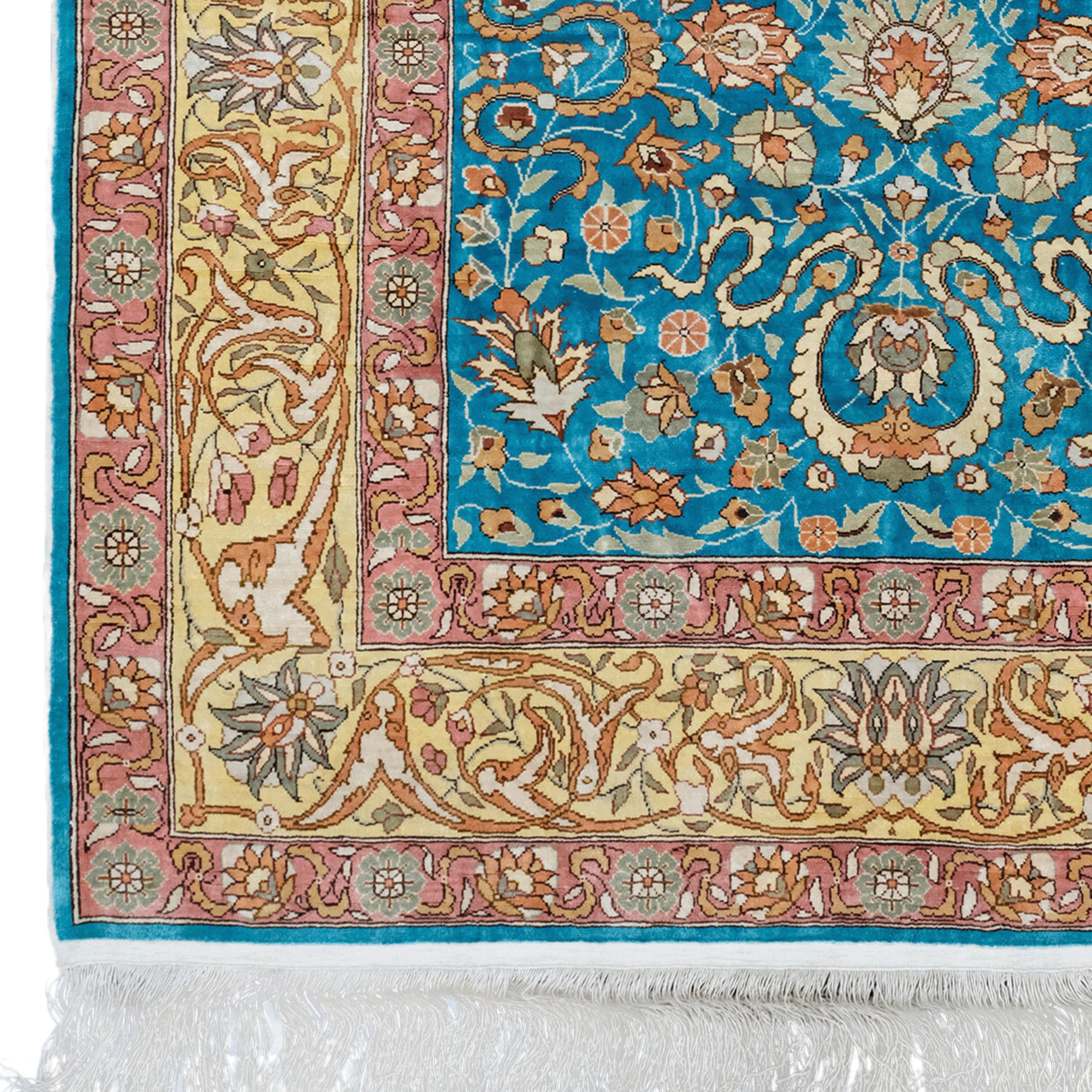 This magnificent 20th century vintage silk Hereke rug represents the pinnacle of luxury and craftsmanship. This masterpiece from Turkey's famous weaving town Hereke has a rich history and unique quality that has been preserved over time. The central