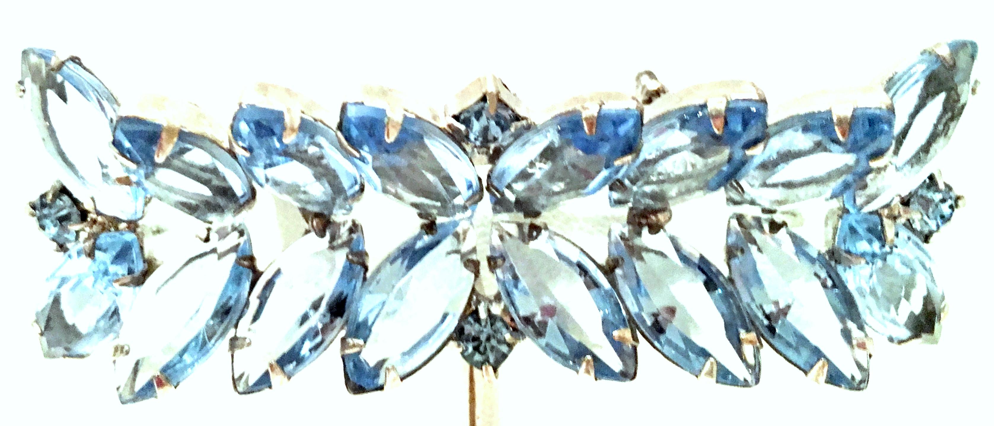Mid-20th Century Silver Plate & Austrian Crystal Abstract Dimensional Butterfly Brooch.  This finely crated, unique and classic piece features silver plate metal with open back brilliant cut and faceted sapphire blue fancy prong set Austrian crystal
