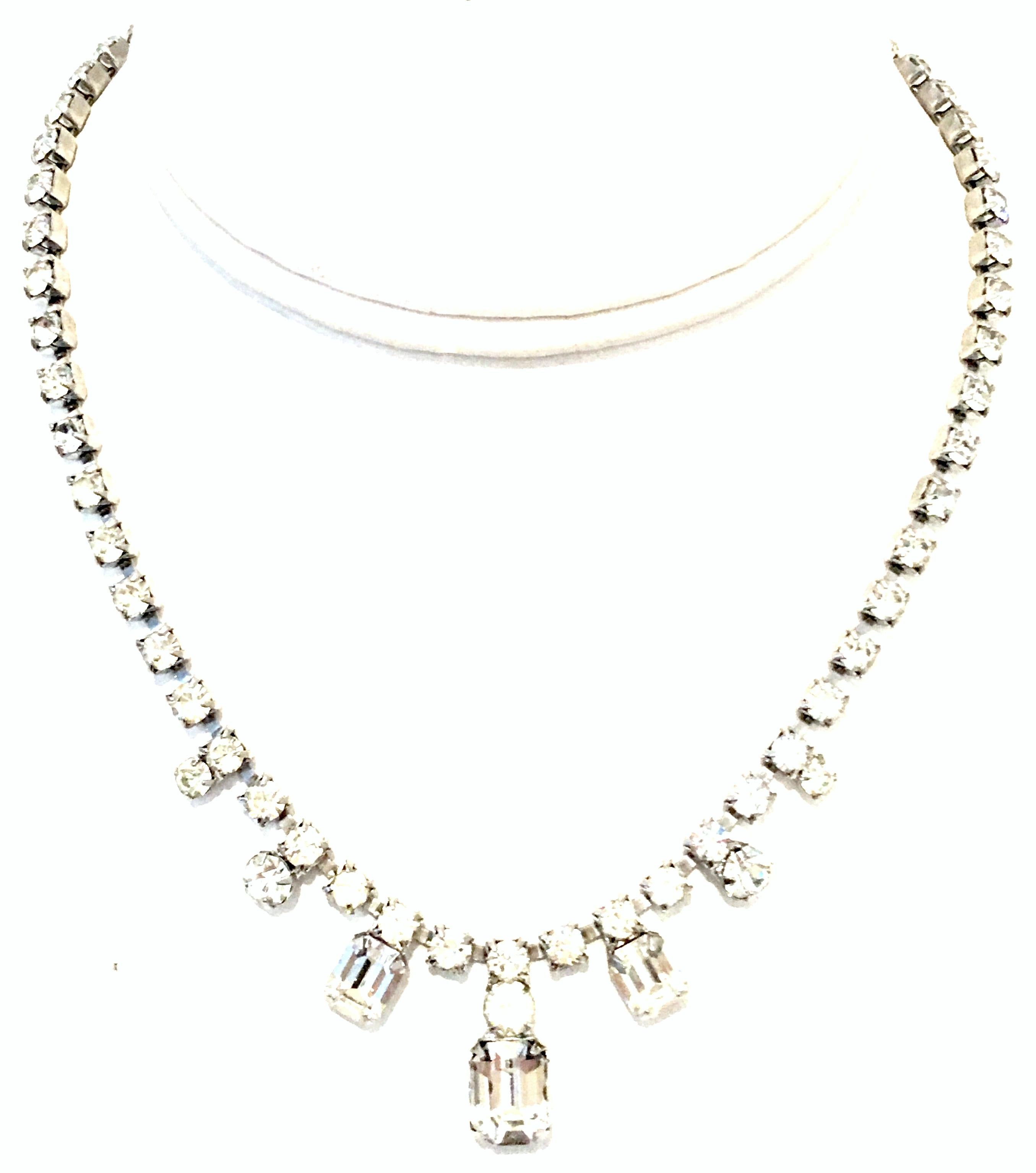 20th Century Silver & Austrian Crystal Choker Style Necklace By, Weiss.
This timeless piece features rhodium silver plate with brilliant cut and faceted colorless Austrian crystal prong set stones. Adjustable hook clasp. Signed on the underside,