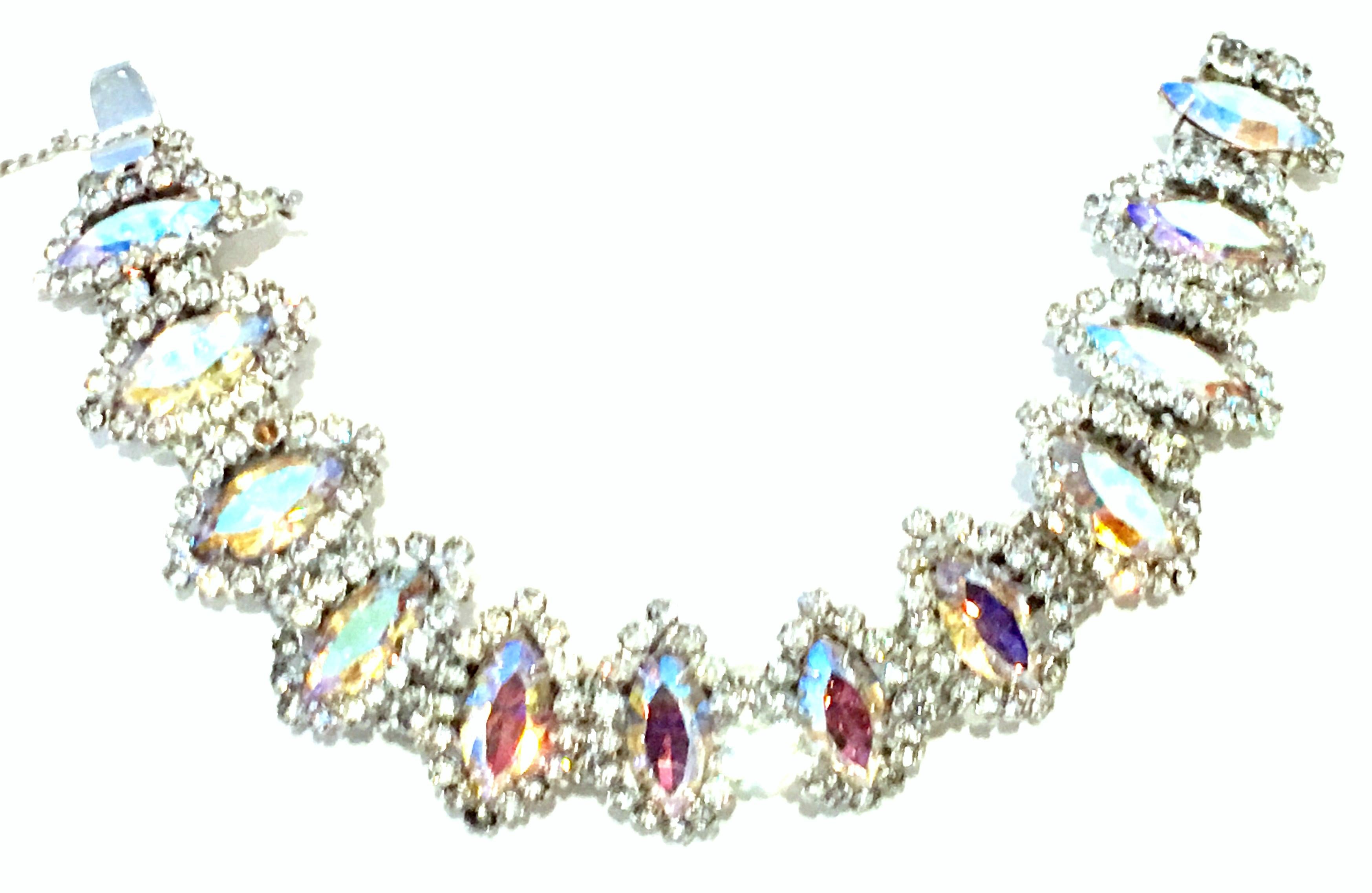 20th Century Silver & Austrian Crystal Link Bracelet By, Weiss. This finely crafted silver rhodium plate link bracelet features twelve dimensional links with fancy prong set 
navette Aurora Borealis stones with applied silver and colorless stones