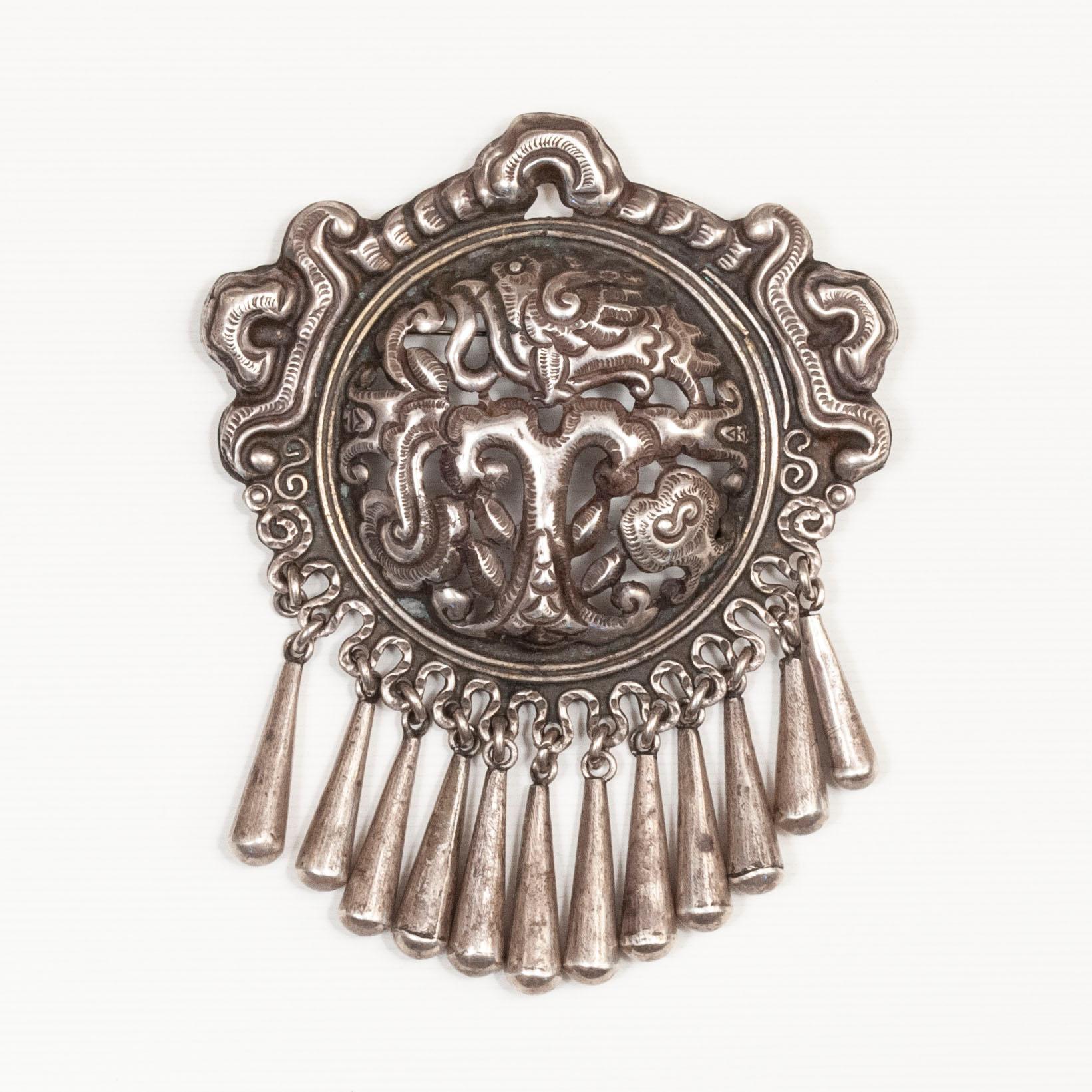 20th Century Silver Brooch by Matilde Poulat of MATL

A large silver repoussé brooch designed by Matilde Poulat and made by Ricardo Salas, her nephew. Matilde Poulat was an influential jewelry designer who opened her Mexico City workshop in the