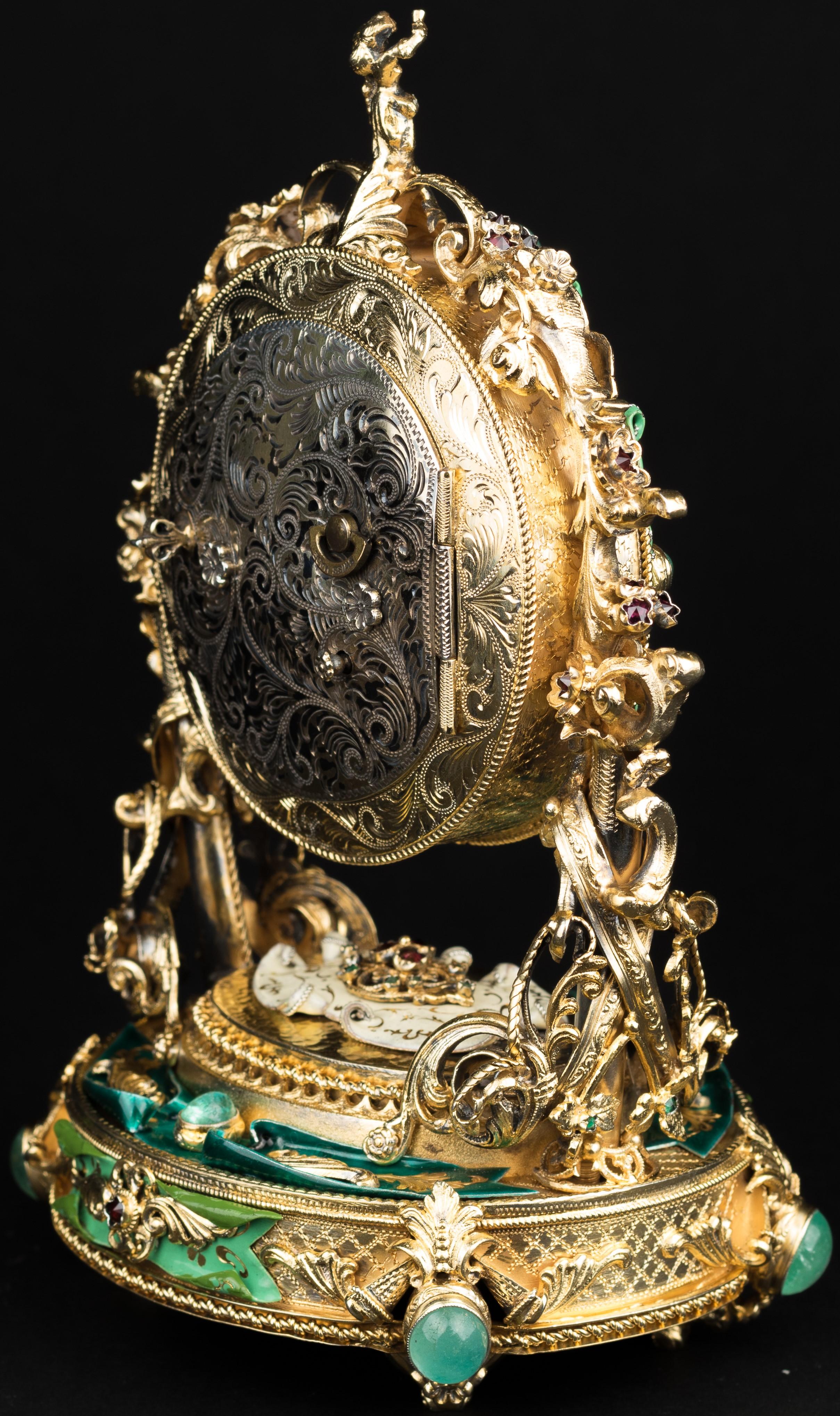 Austrian silver-gilt clock with green enamel, 20th century. The back is engraved with scrolls.
