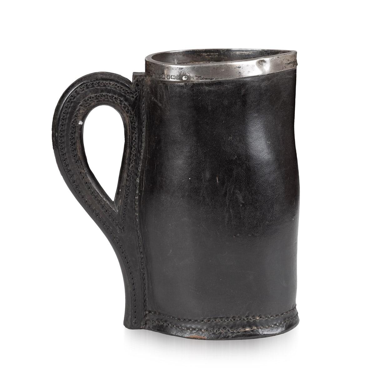 A beautiful leather “black jack” in the form of a jug with an applied silver rim with hallmarks for Sheffield, England, 1913. Dating to just before the Great War, this black jack was realised by Frederick James Ross, a well known maker for