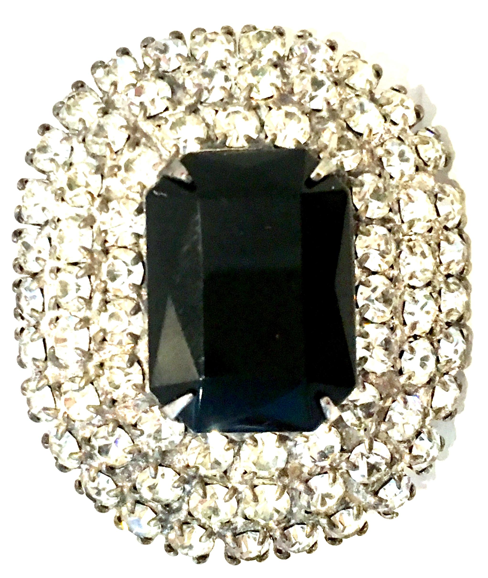 20th Century Silver Plate & Austrian Crystal Dimensional Brooch. This dramatic, classic and timeless brooch features silver plate prong set stones with a large central brilliant black cut and faceted emerald cut stone measuring approximately, .75