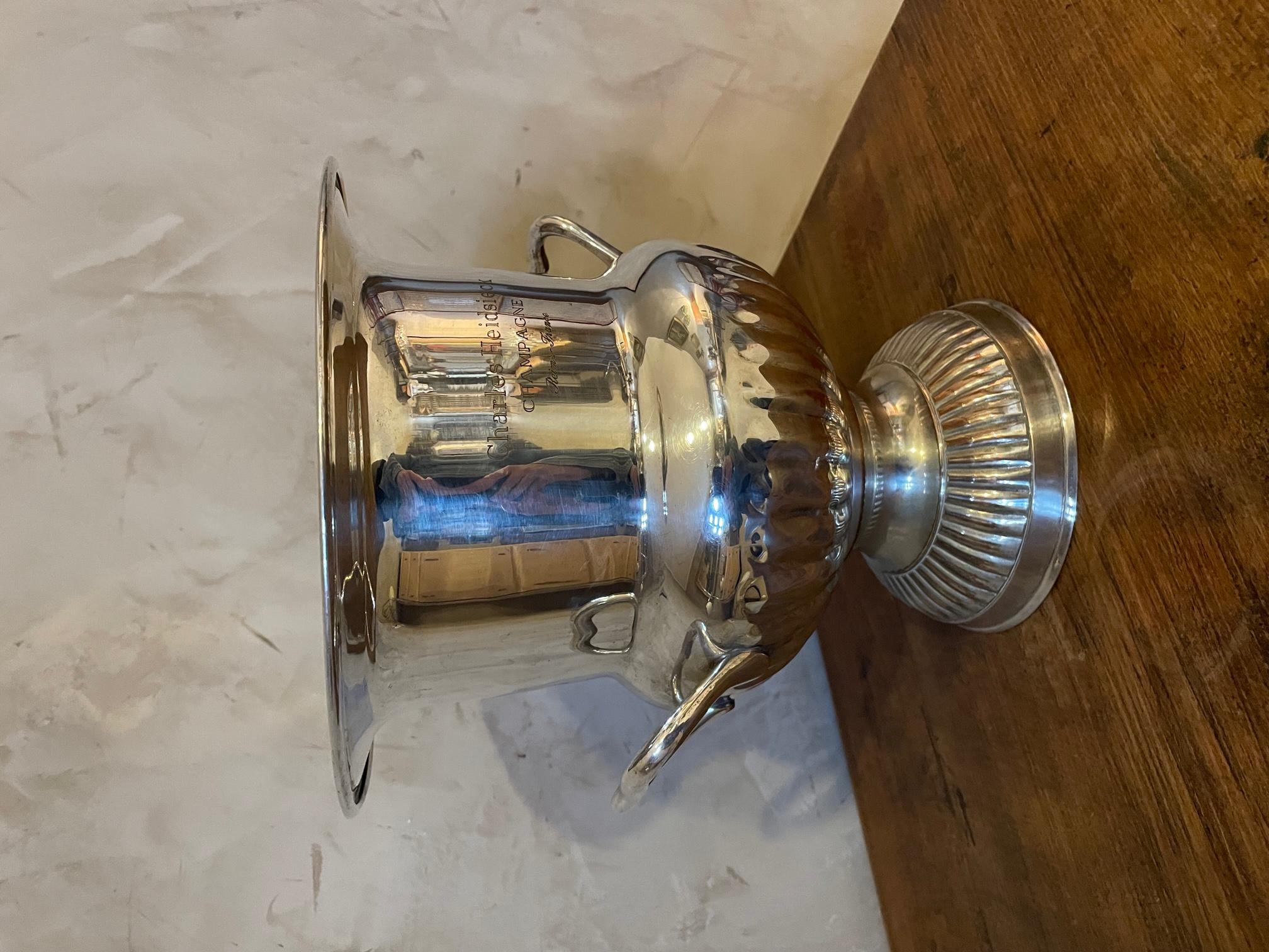 Very nice silver plate Champagne bucket made for Charles Heidsieck a Champagne house with two handles. 
Stamp of the French champagne house and 