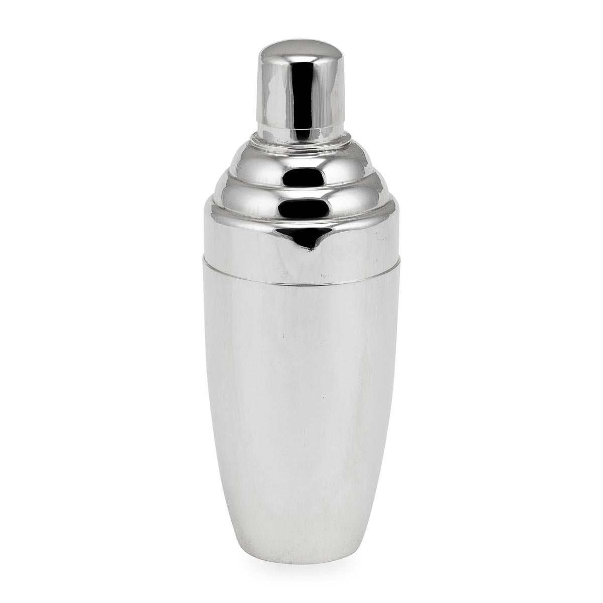 A charming silver plated cocktail shaker, of English origin and dating back to the middle part of the 20th century. Exquisite in its craftsmanship, the cocktail shaker is of clear Art Deco form, reminiscent of the distinctive designs that