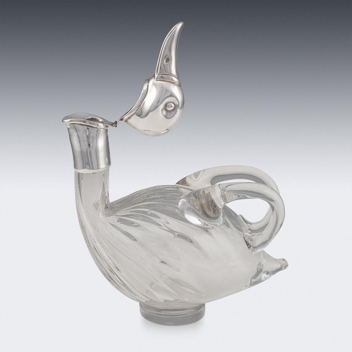 Superb mid-20th century silver plated mounted novelty claret jug modelled as a duck, plain glass body, the wings forming the handles, hinged head set with glass eyes. Such novelty claret jugs are rare and sought after. it is easy to imagine the