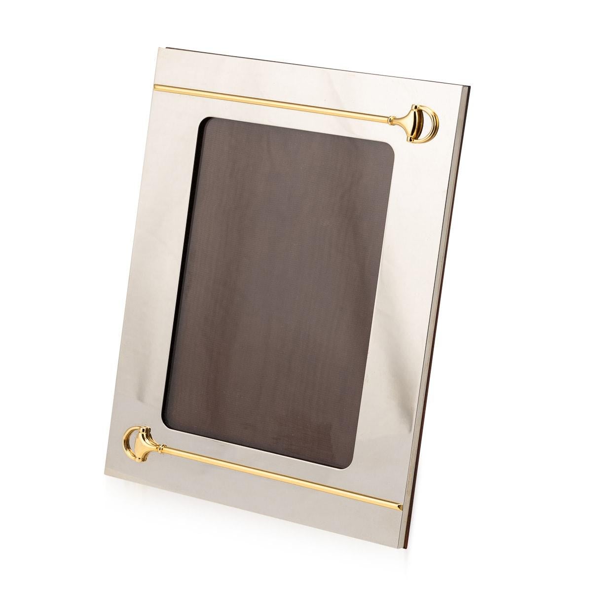 Enhance your cherished memories with this Gucci photograph frame in silver plate, crafted in Italy circa 1980. Its timeless elegance and versatile design, allowing for both vertical and horizontal display, make it a sophisticated showcase for your