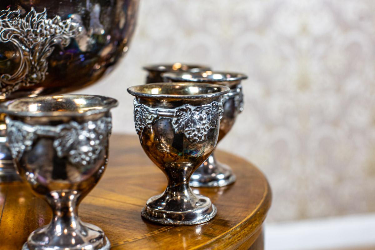 silver punch bowl with cups