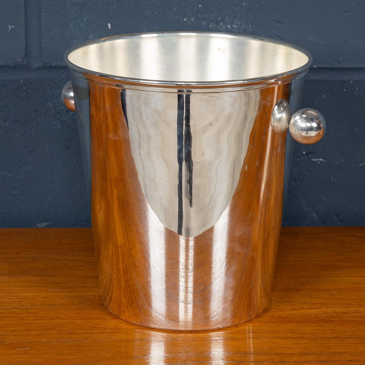 A lovely silver plated Art Deco wine cooler or champagne bucket. With a lovely tapered shape and ball handles, this champagne bucket dates from the 1940s or 50s and is fully restored. Stamped by the retailer Mappin and Webb to the underside, the