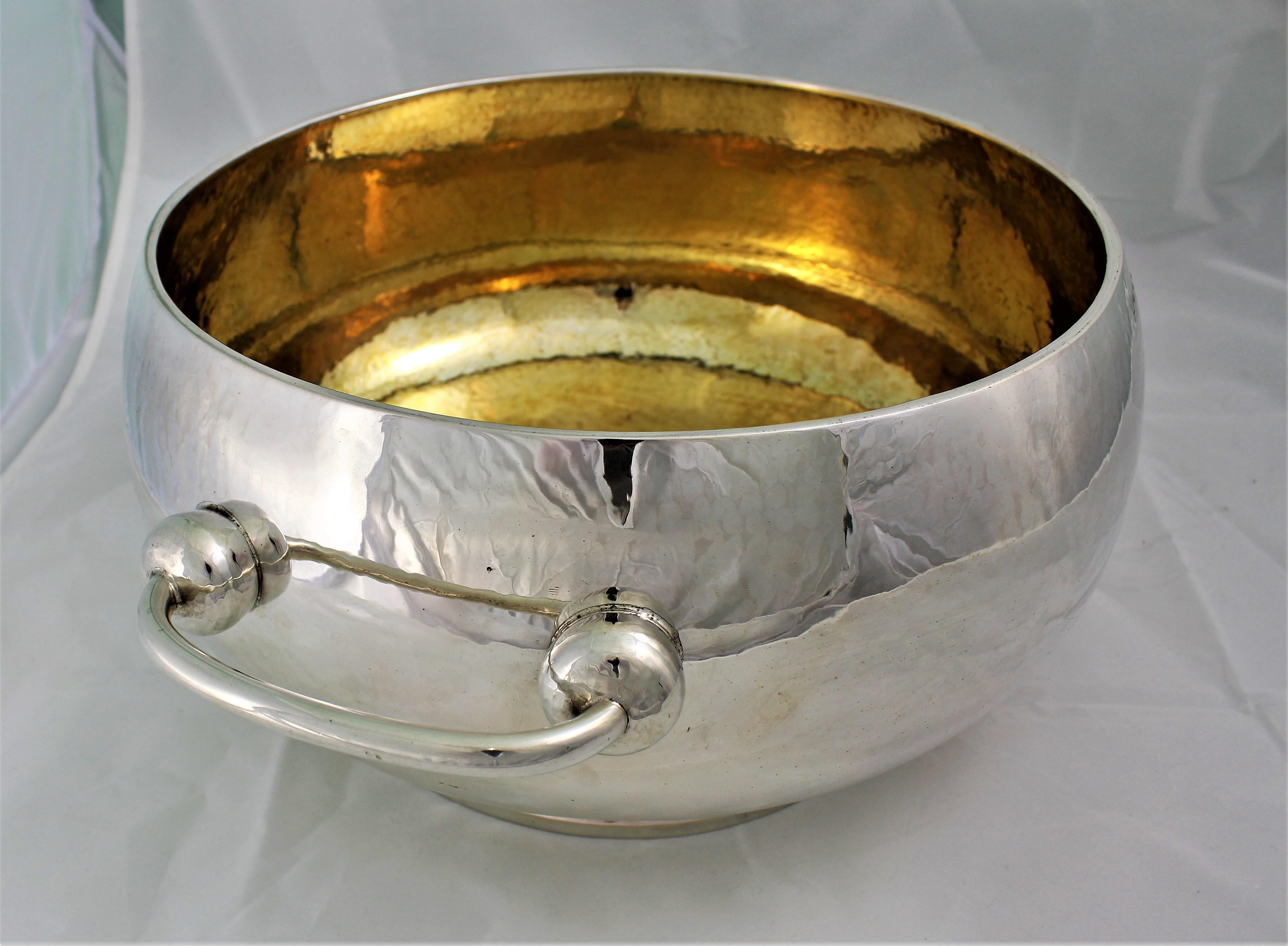 Large silver punch bowl round shaped with handles.

Hammered and gilded on the inside.

Realized in Florence by Brandimarte company in the early 1970s.

Very scenic and particular object.

Size: 45 cm x 35 cm - H 19 cm.

 