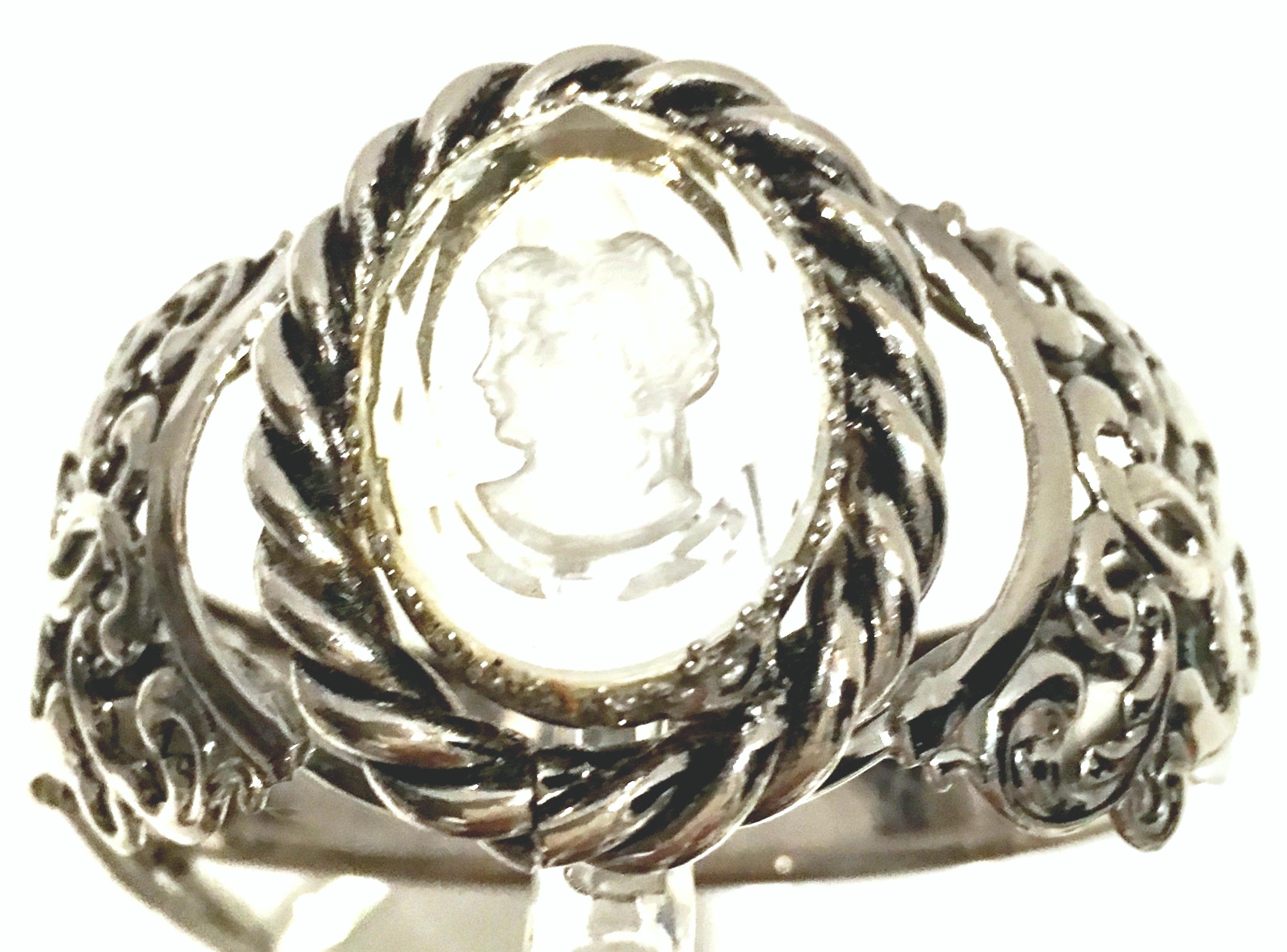 1970'S Silver & Reverse Carved Glass Cameo Bracelet In The Style Of Whiting & Davis. This lovely Victorian style bracelet features, silver plate open filigree work with a central transparent reverse carved cut and faceted left facing female Cameo.