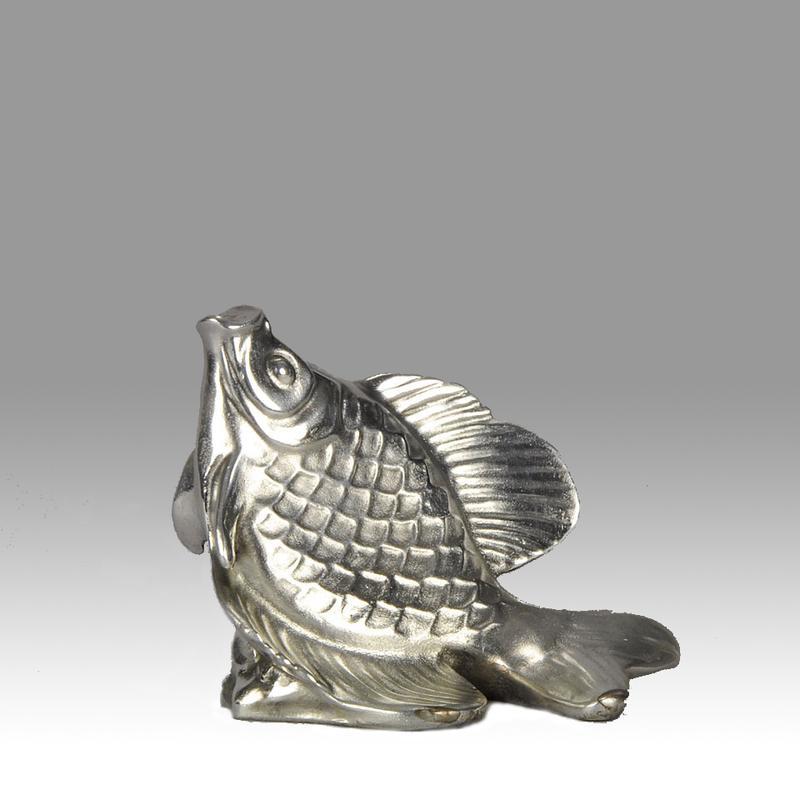 A very fine Art Deco study of a leaping fish with fine silvered surface with good hand chased detail in a naturalistic manner adding to the strength and animation of this well modelled figure. Signed E M Sandoz and inscribed with foundry mark Susse