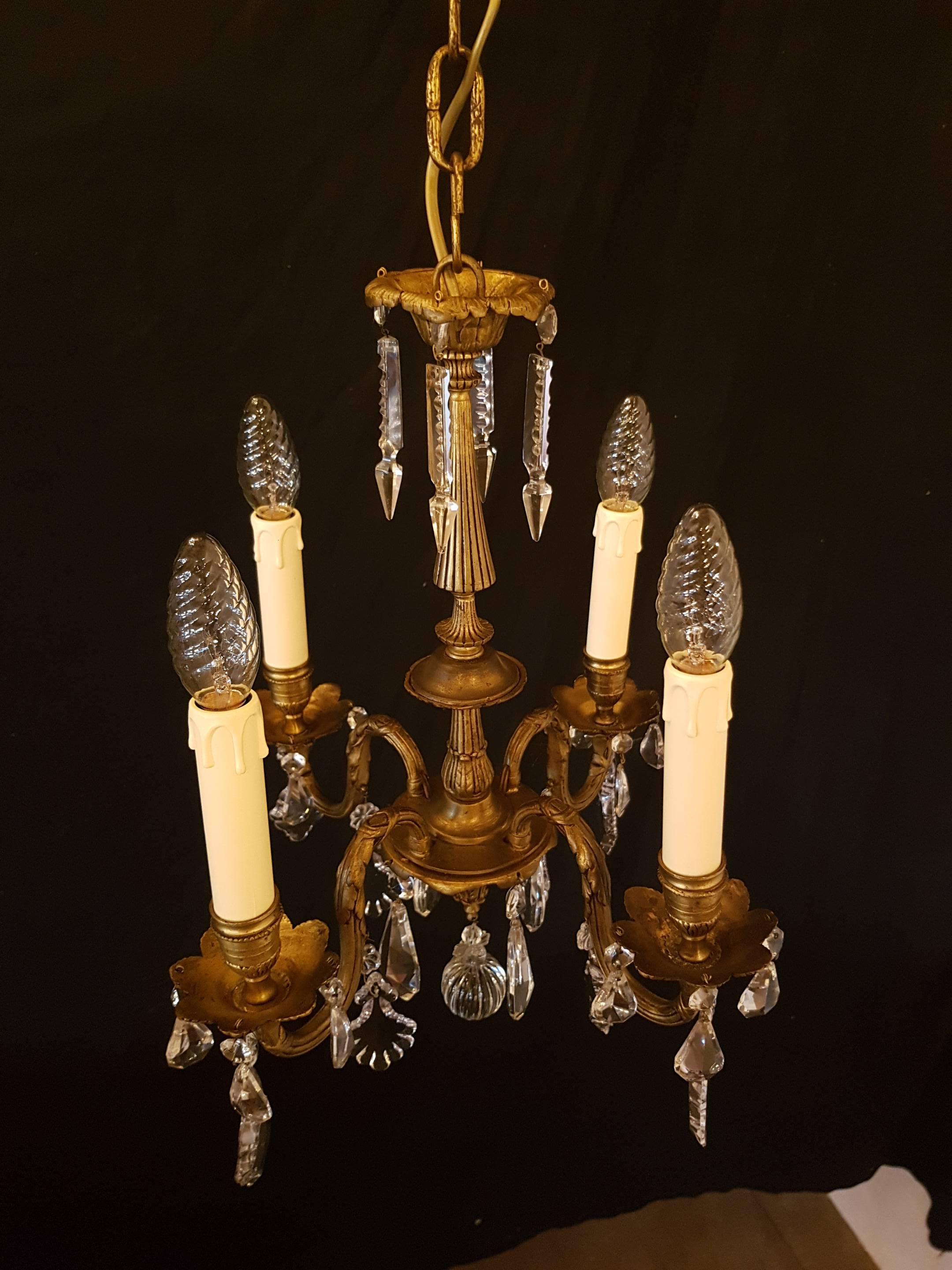 Small French bronze chandelier with four lights.