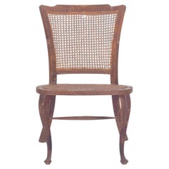 Petite chaise du 20e siècle avec assise et dossier en paille