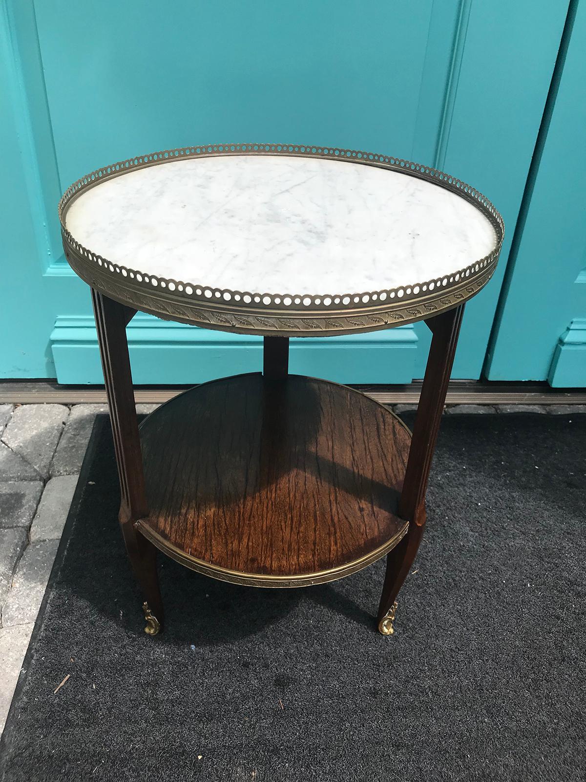 20th century small round marble side table with bronze gallery.