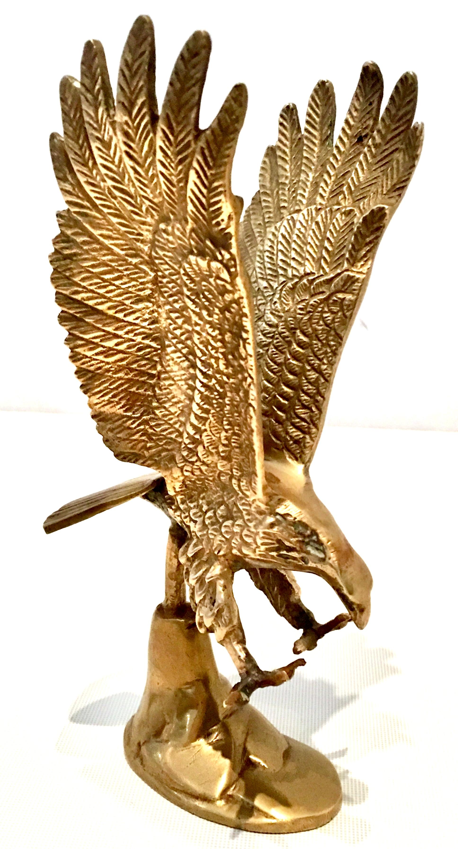 Vintage solid brass perched eagle sculpture by Enesco. The original manufactures sticker is in tact and reads, solid brass-made in India-Enesco.