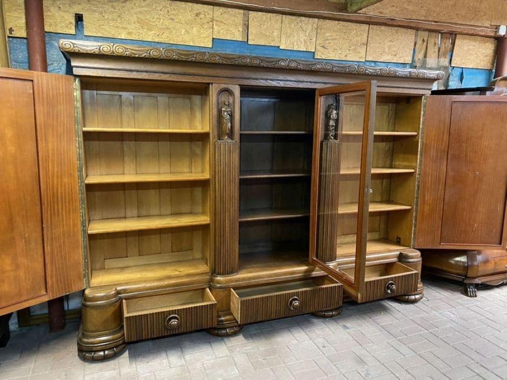 Beautiful antique library from first half of the 20th century. Perfectly kept, in very good condition, ready to be inserted and used, it will surely decorate any interior! A very representative piece of furniture, richly carved with a solid and