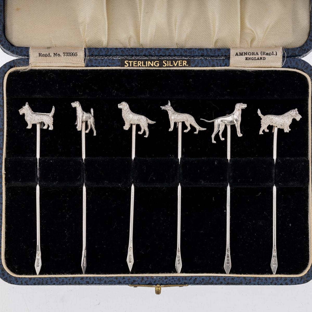 Antique 20th Century George V solid silver set of six cocktail picks, mounted with cast models of various dog breeds. The set comes in its original leatherette and velvet lined box. Each piece is Hallmarked English silver (925 Standard), Birmingham,