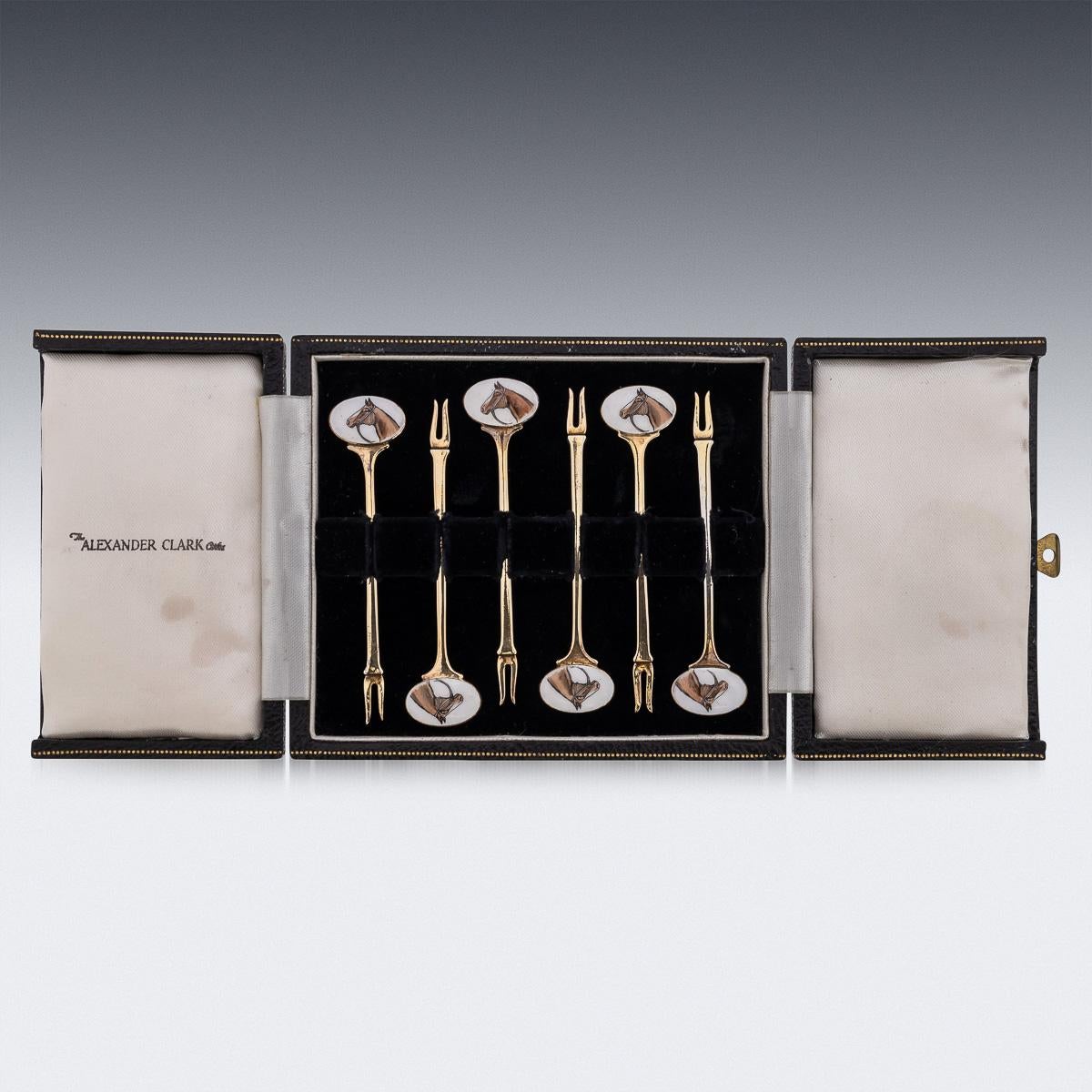 Mid 20th Century British solid silver-gilt set of six cocktail picks, decorated with enamels depicting race horses. The set comes in its original leatherette and velvet lined box. Each piece is Hallmarked English silver (925 Standard), Birmingham,