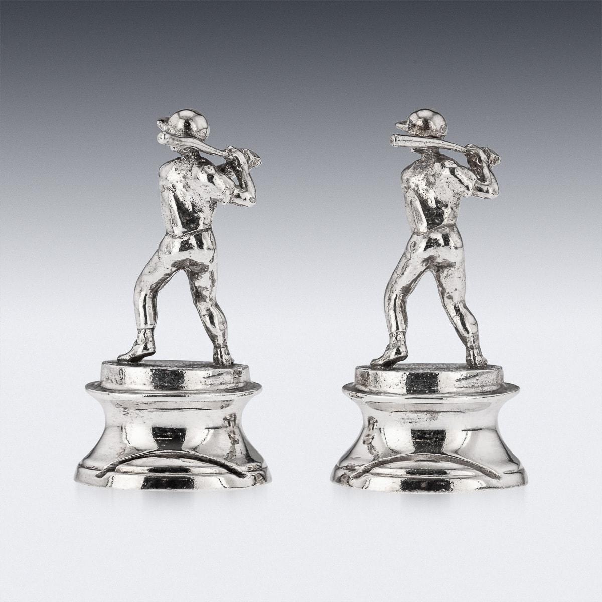 Novelty 20th Century solid silver pair of menu holders, each holder modelled as baseball player in the original retail box. Hallmarked English silver (925 Standard), London, year 1995 (v), Maker's Theo Fennell.

CONDITION
In Great Condition - No