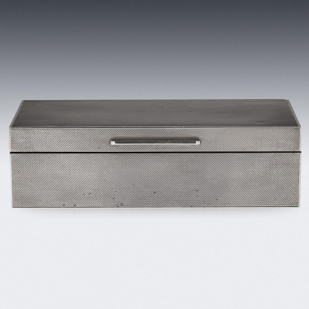 Antique mid 20th Century simple and elegant box with a multitude of uses, currently perfect for storing cigarettes or cigars but equally adept at storing jewellery or trinkets. The solid silver body is unsually finshed in all-over engine turning - a