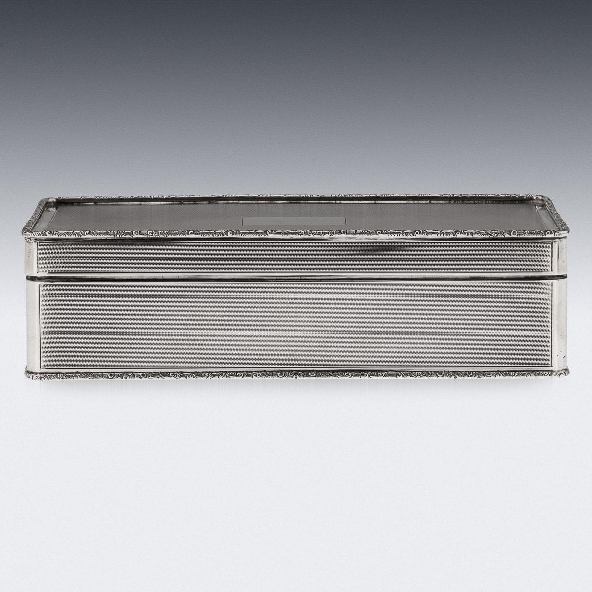 Elegant mid-20th Century English solid silver cigar box and match box holder, beautiful and very stylish engine-turned design, applied with a cast scroll boarders, These two high quality pieces make quite the double act. The simple and elegant