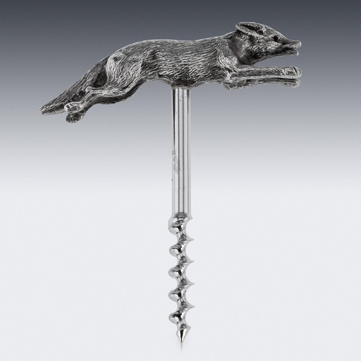 A late 20th century rare novelty corkscrew in the shape of an fox. It is made of solid silver, featuring red glass eyes and is offered in great condition. A wonderful item which would look fantastic in any country home, someone with a passion for