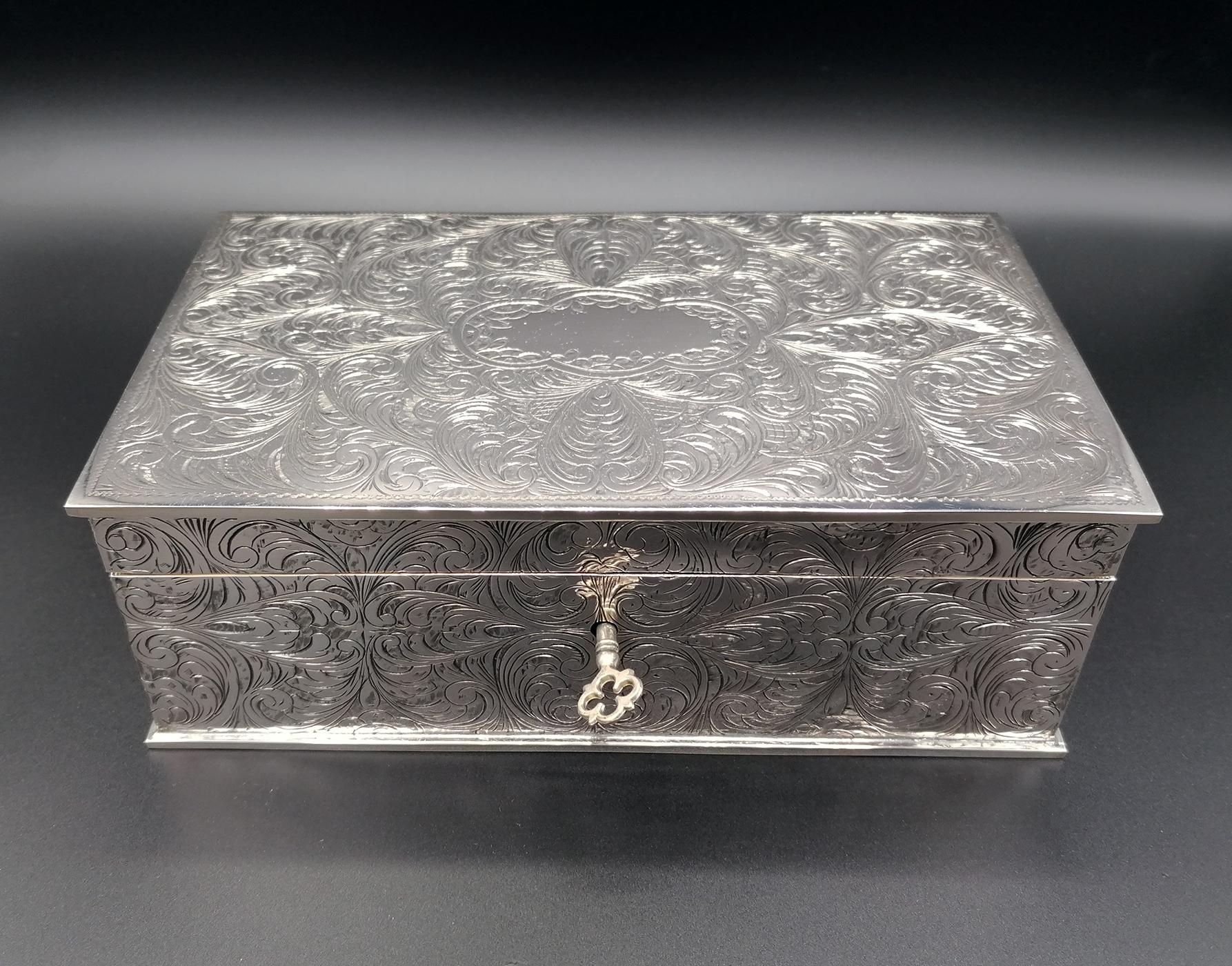 Rectangular jewelry box. The box was made of 800 solid silver and completely hand engraved with typical scrolls of engravings that were fashionable in Renaissance Florence.

The interior is completely covered in dark red velvet and complete with a