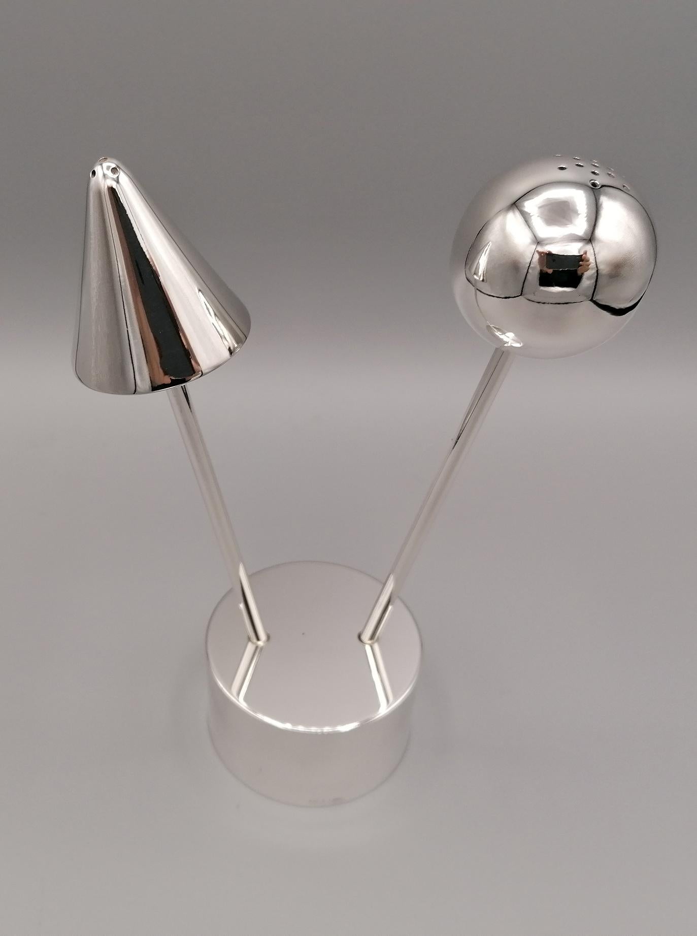 800 silver solid silver salt and pepper set of modern design. Created to be not only a useful object but also a decorative one.
The salt is a silver ball with holes for the salt to come out.
The pepper is conical with small holes for the pepper to