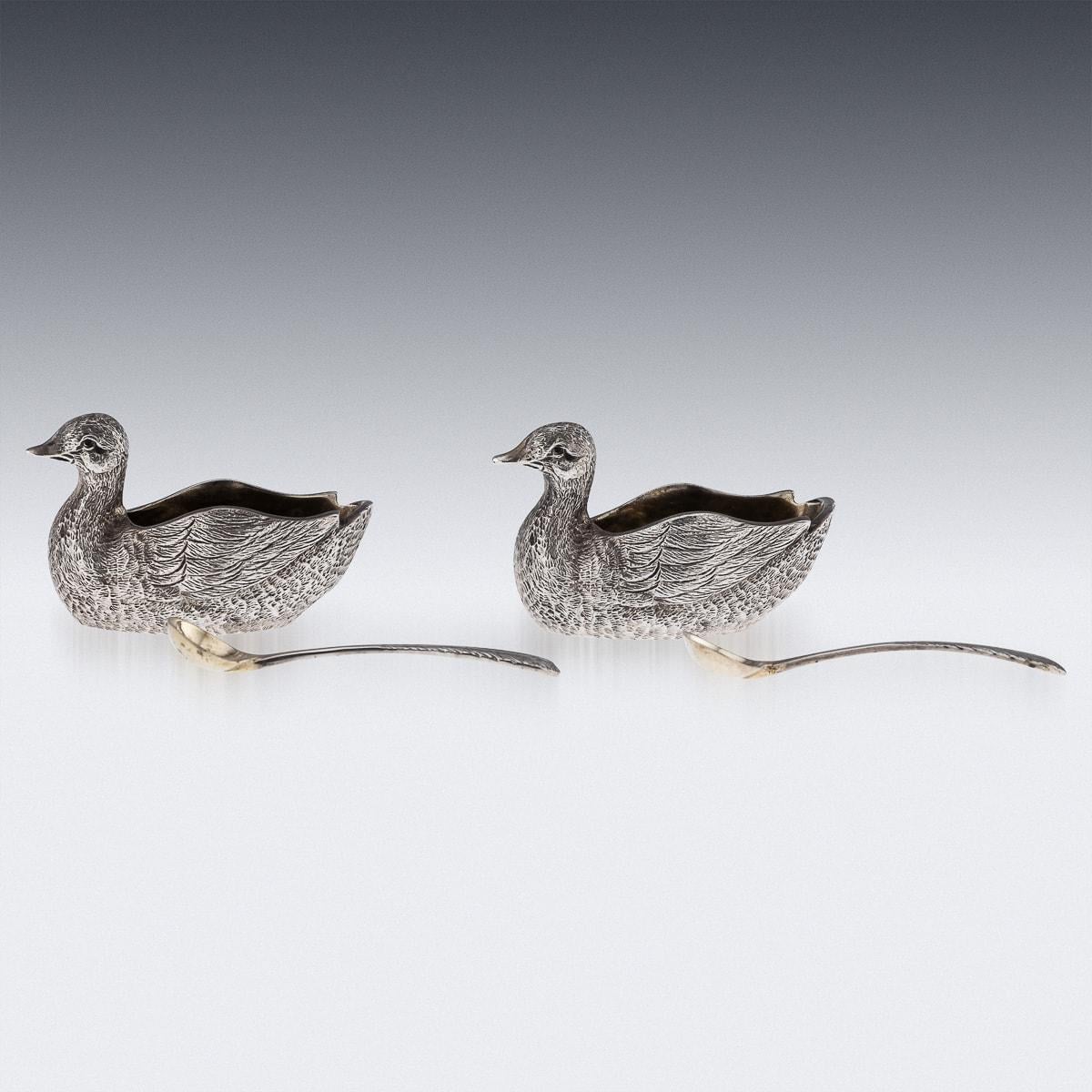 Late 20th Century solid silver pair of novelty duck shaped salts & spoons, beautifully cast and realistically modelled as a ducks, the body cast with a detailed textured plumage. Hallmarked English silver (925 standard), London, year 1982 (H),