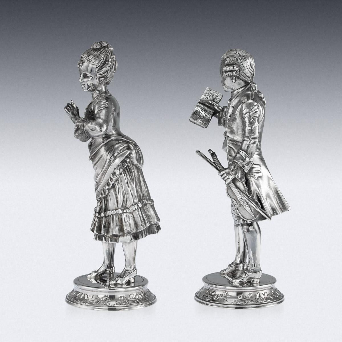 Impressive 20th century pair of novelty solid silver figures of a man and woman in 18th century costume, the man modelled holding a violin and book, the woman elegantly posing with a flower in hand. Both hallmarked on the base 925 (925 silver