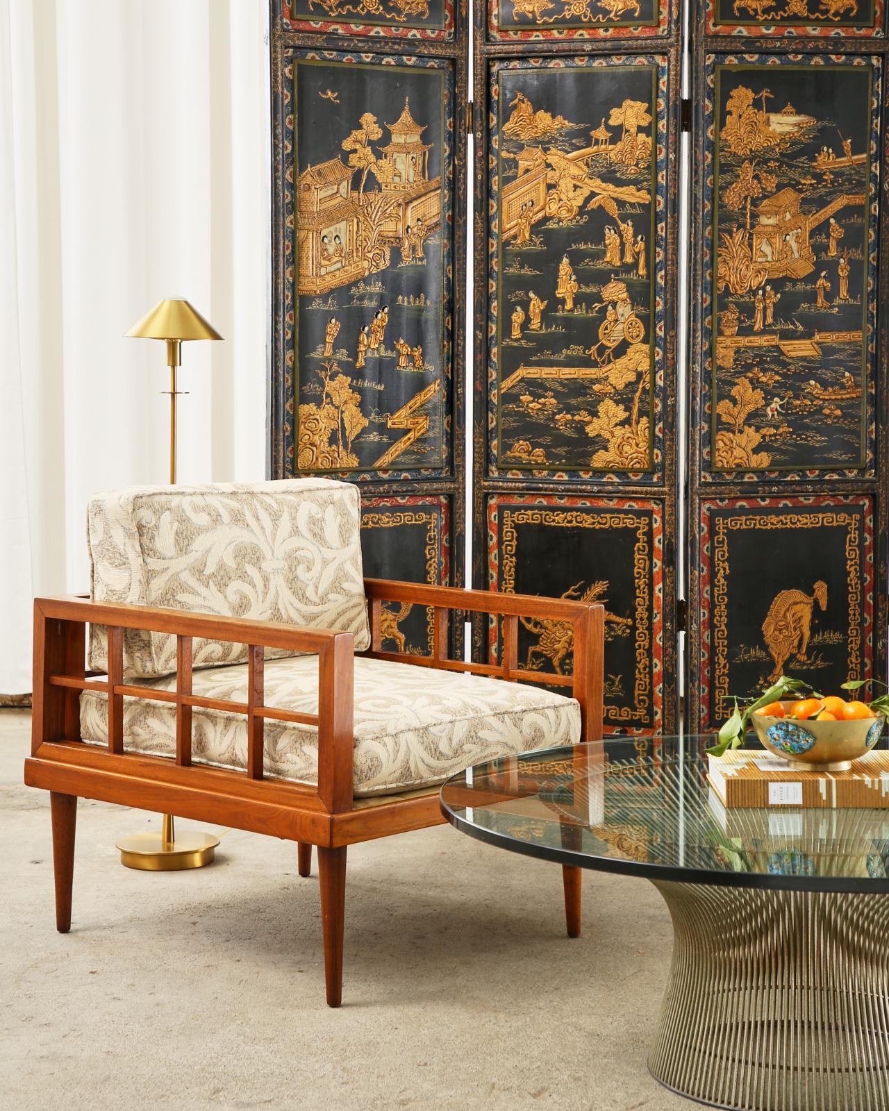 Colorful 20th century lacquered coromandel screen from China. The four panel screen features raised panels painted with idyllic scenes in parcel gilt and color pigments. The top and bottom windows are decorated with mythical beasts having colorful