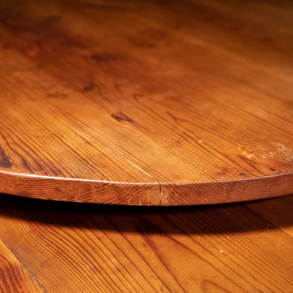 A exceptional solid pine table with full dimensional pine, scalloped skirt, fine tapered legs with a 33” lazy susan. 
This is a very well built hi-quality antique 

 Table was from a fiire station and is untouched original condition.