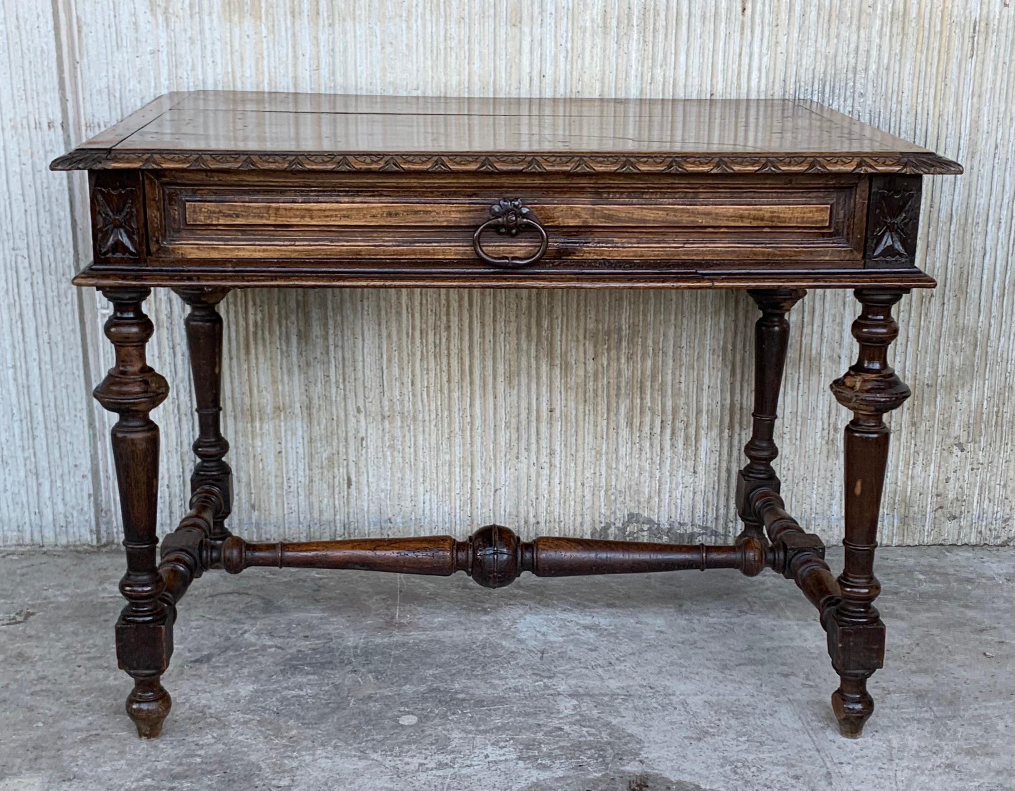 Handsome oak library piece that can be used as a desk, center table or side table. Made of oak having carved gadrooned edges. A stretcher made of wood. Carved on all sides and one drawer, early 20th century.


