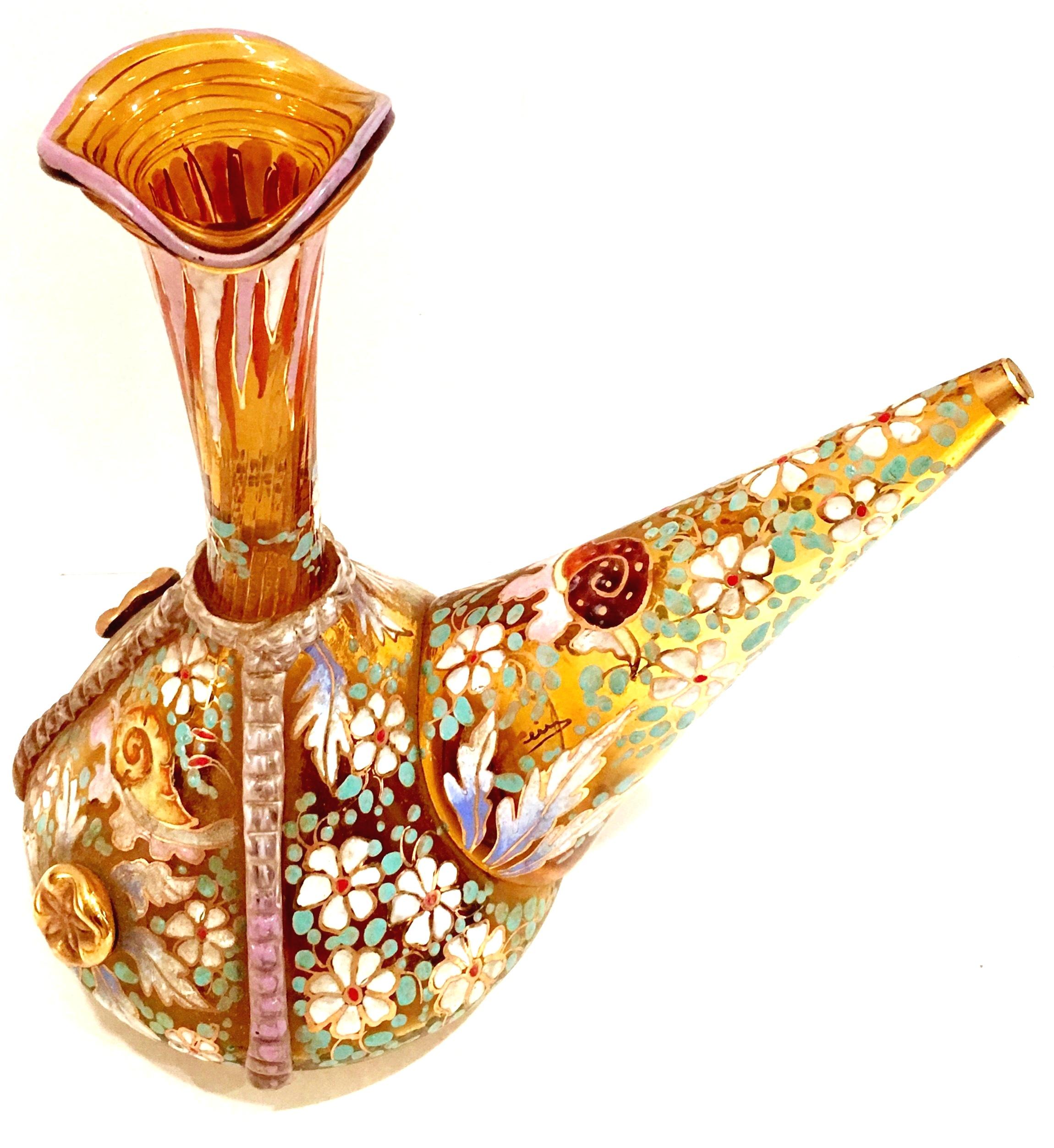 20th Century Spanish mouth blow glass moser style amber vino wine bottle. This incredibly detailed piece features hand applied raised enamel, crimped glass with gilt detail. The star fish medallions are hand applied gilt glass. Artist-signed in gold