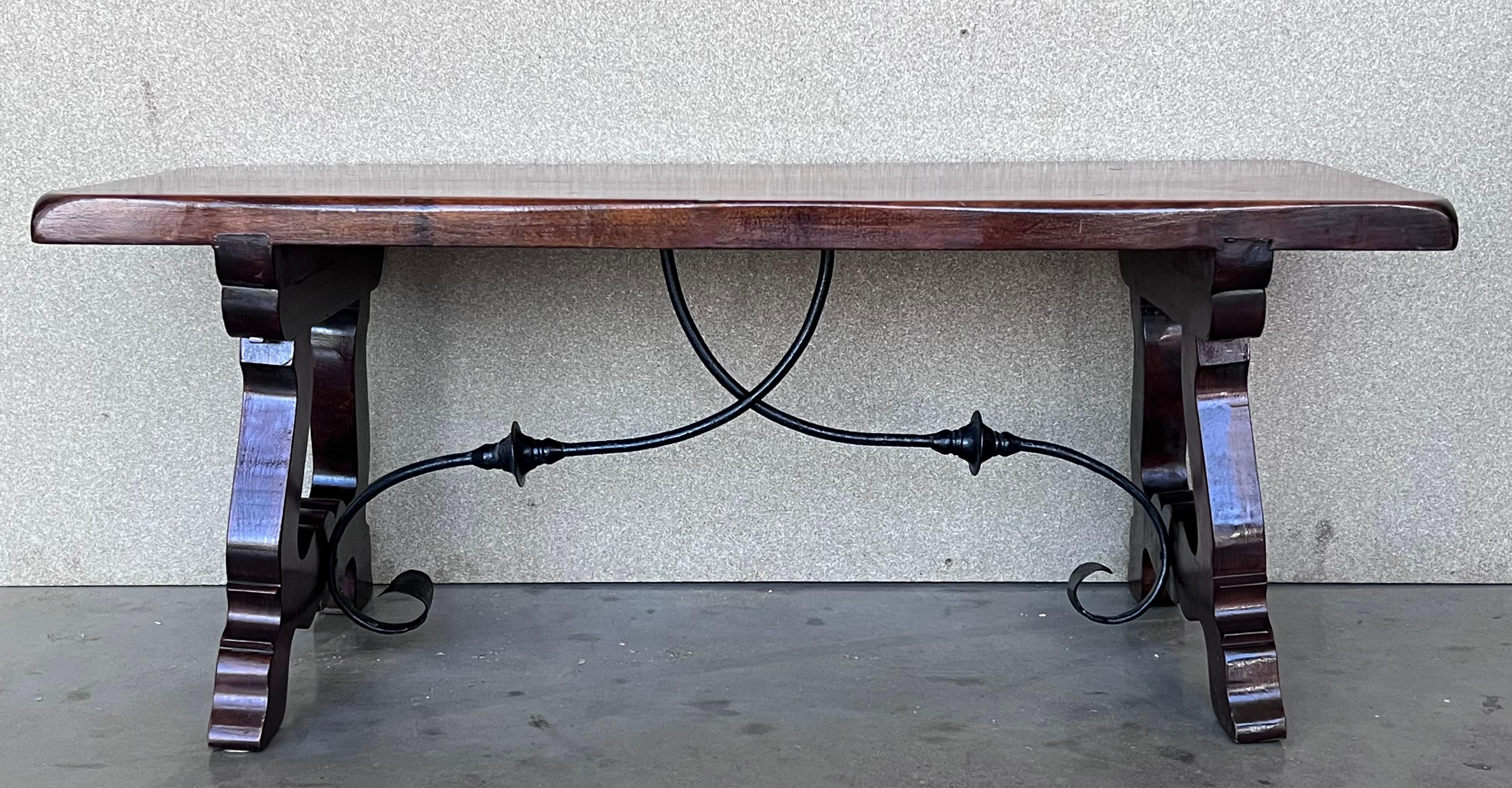 20th Century Spanish farm table with wood columns stretchers and beautiful top.

An unusual form with nice shiny patina. Nice size for a side or end table, or as a lamp table. Graceful carved drawers. Highly decorative.

Completely restored.