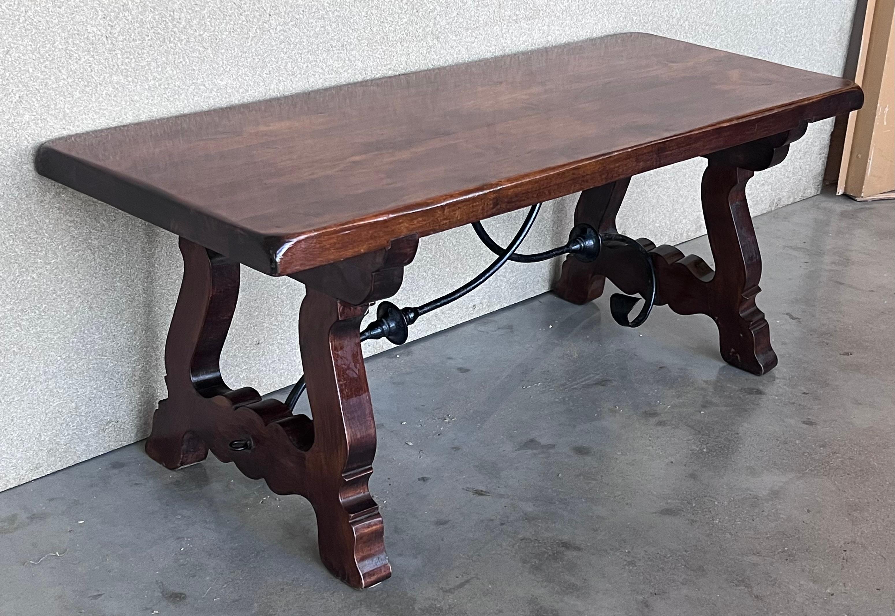 Spanish Colonial 20th Century Spanish Carved Table with Iron Stretchers For Sale