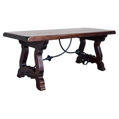 20th Century Spanish Carved Table with Iron Stretchers