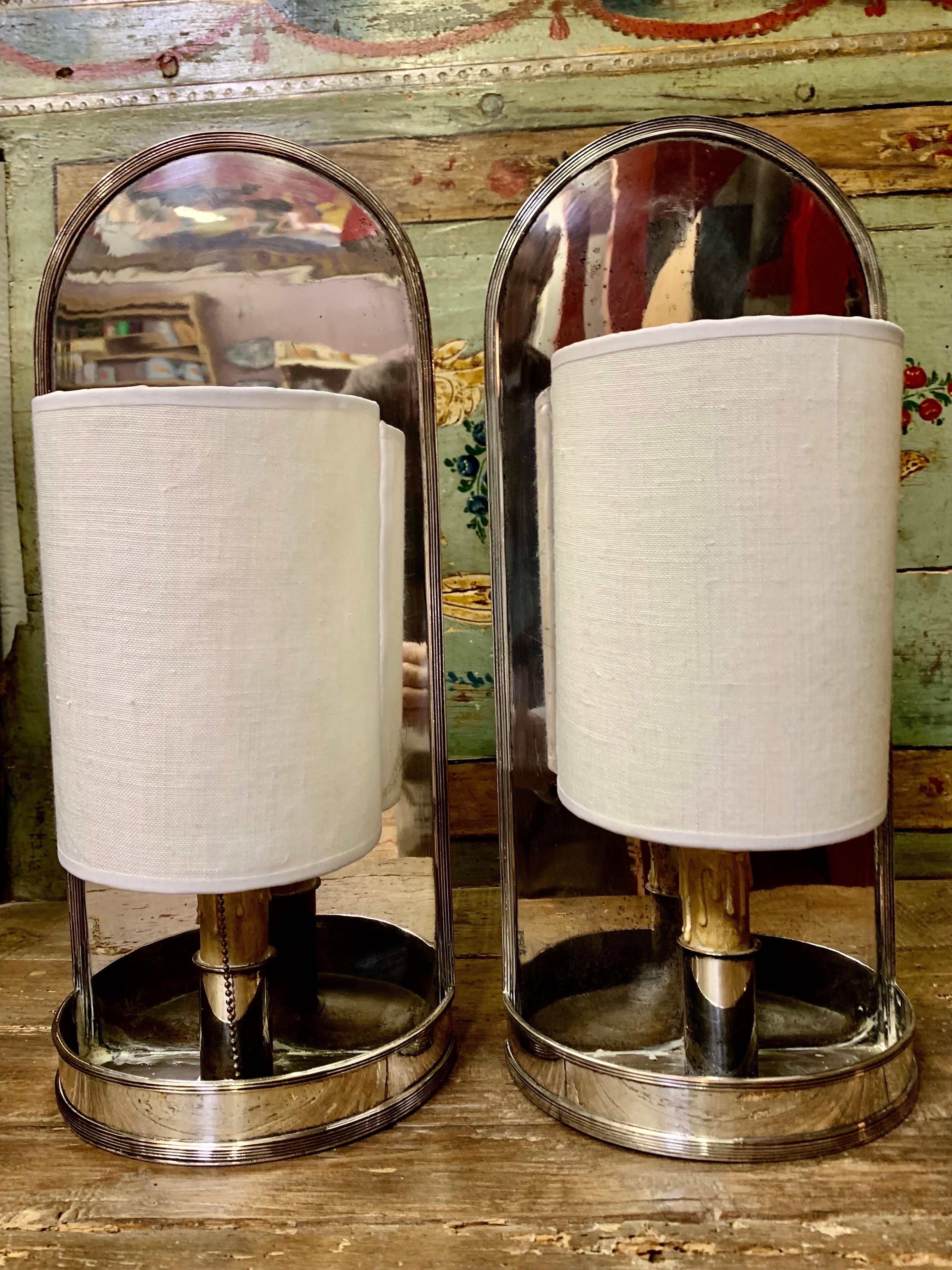 A pair of wall sconces, in silver metal and wax, original from the 60s, from the Spanish firm VALENTI.