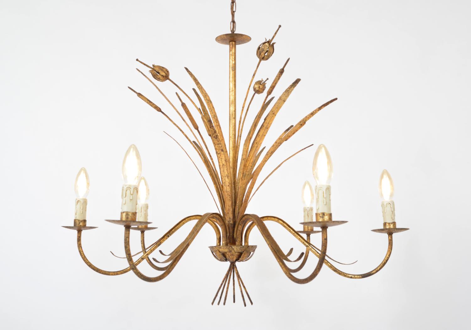 This stylish and elegant mid 20th century Toleware bulrush chandelier has a wonderful patina, and the gilt metal sparkles beautifully when lit. Hanging from its original scalloped ceiling rose, the chain extends to a gilt metal rod, which is